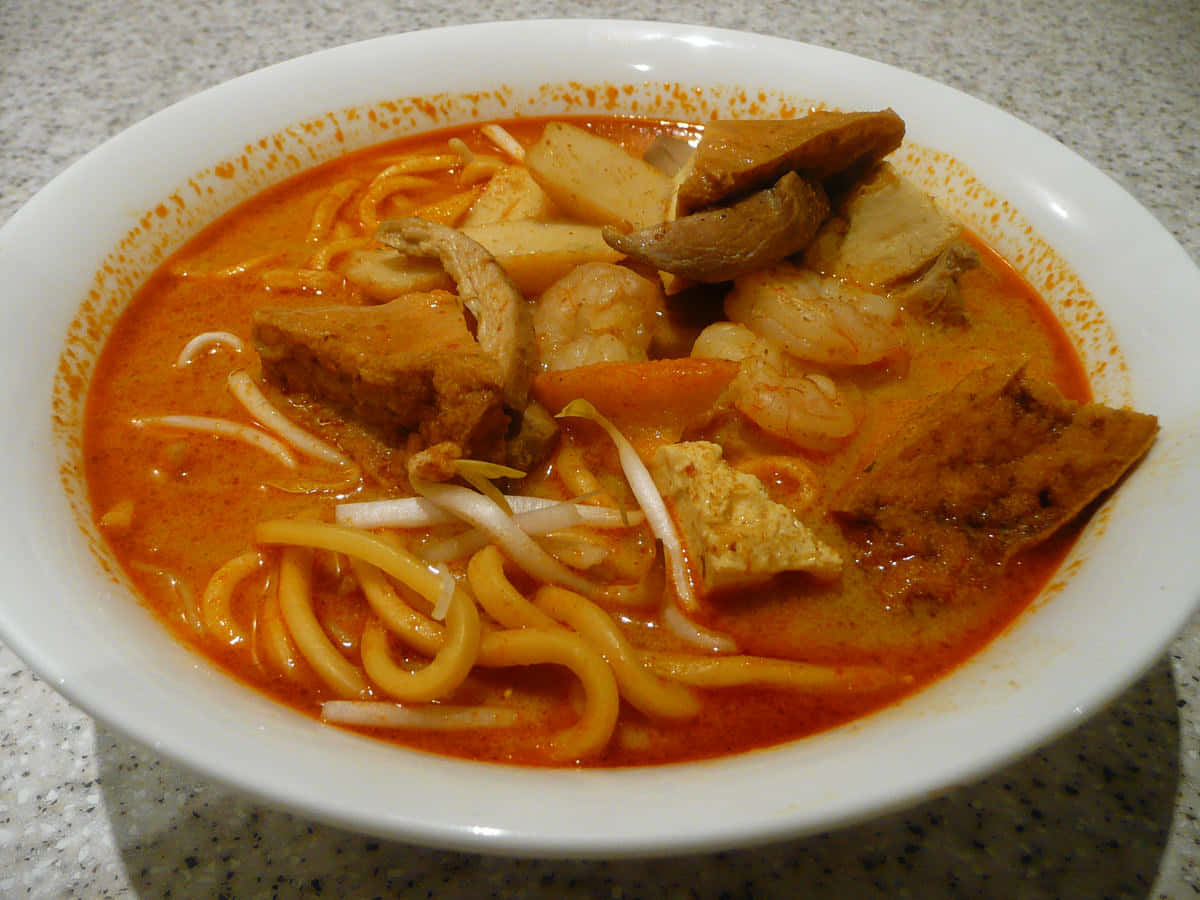 Homemade Curry Laksa, steaming bowl, rich orange curry noodle soup, SD Desktop Wallpaper
