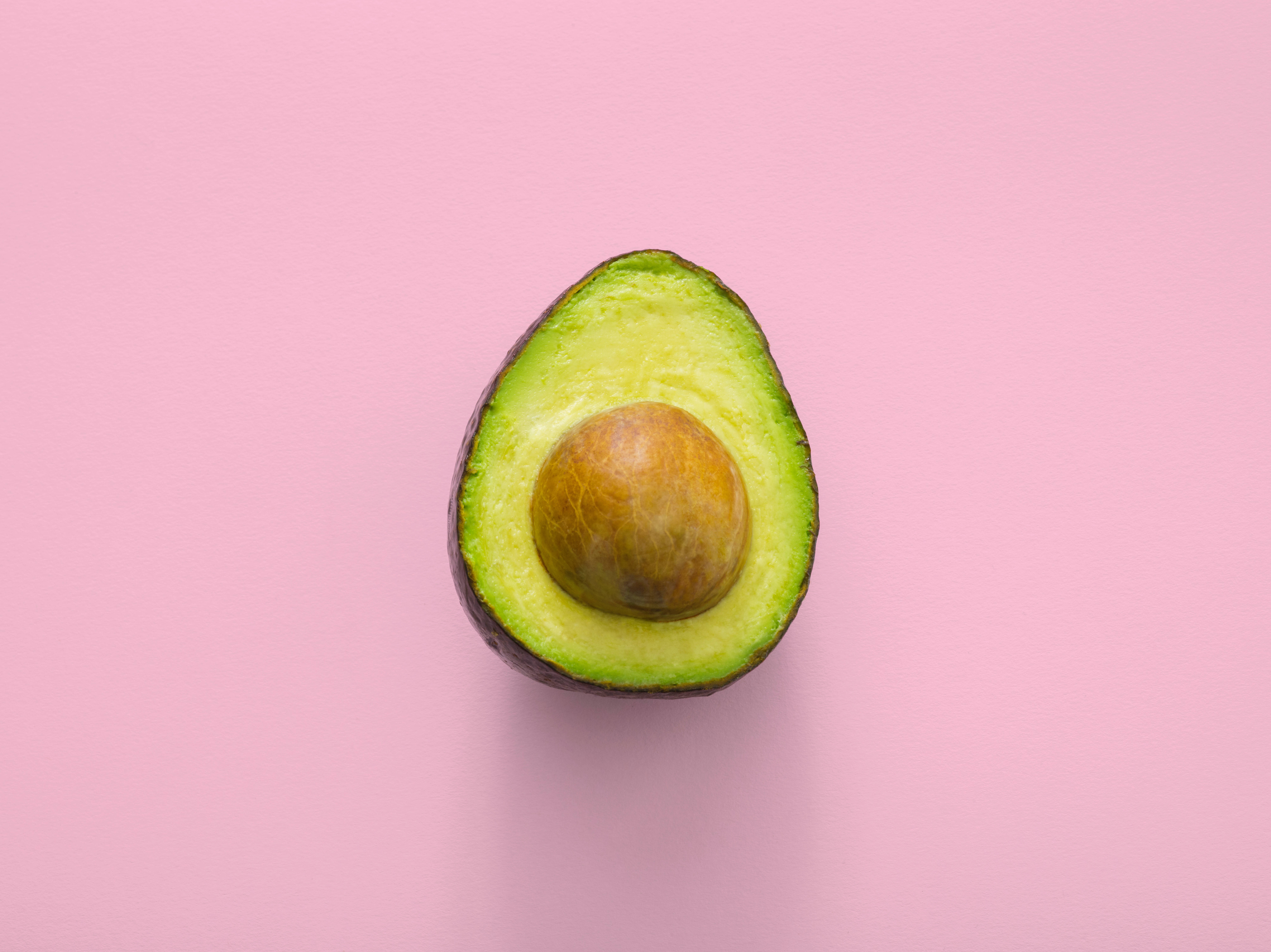pink minimal avocado, halved avocado, brown pit, 8K Desktop Wallpaper