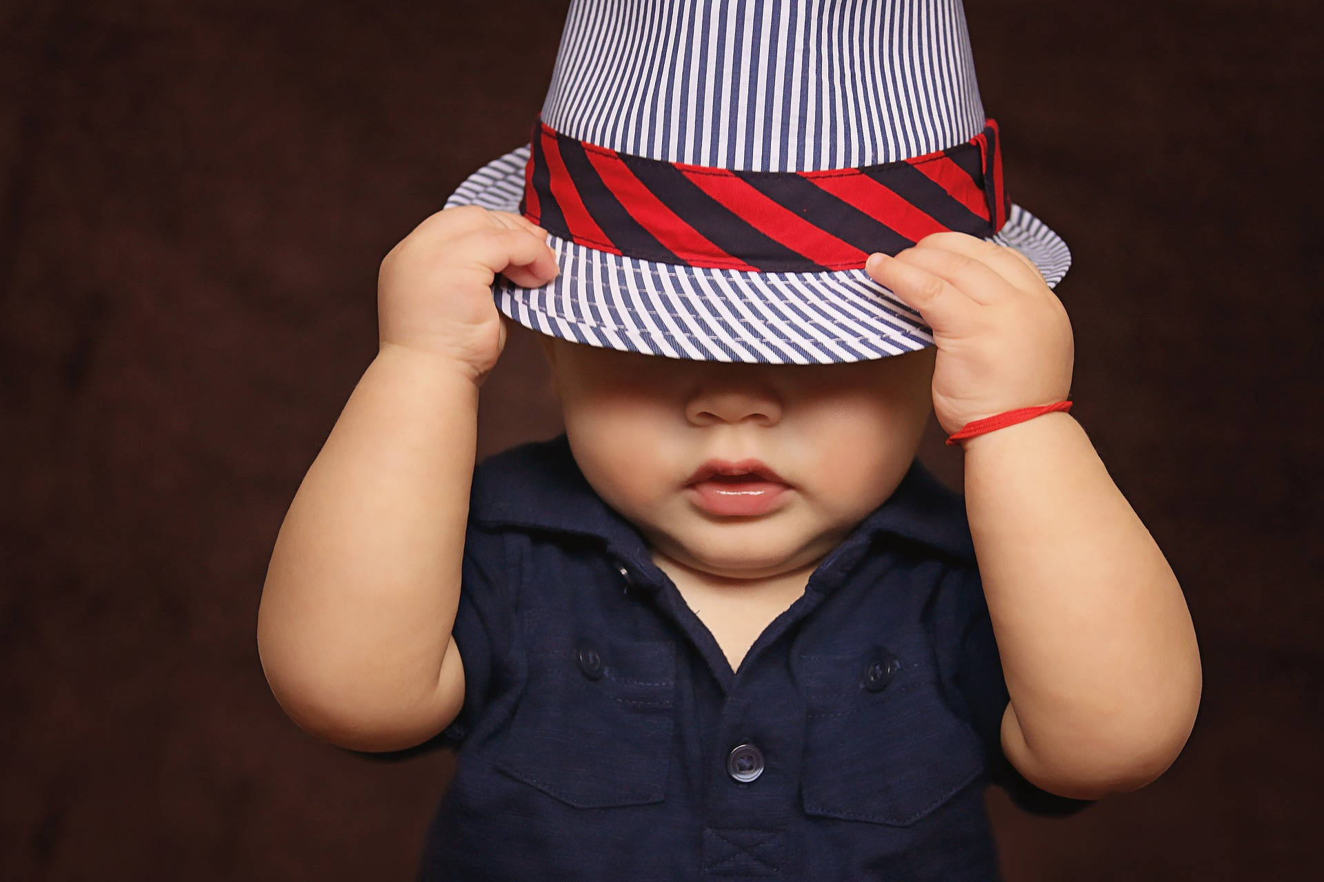striped hat, dark brown backdrop, baby, Full HD Desktop Wallpaper