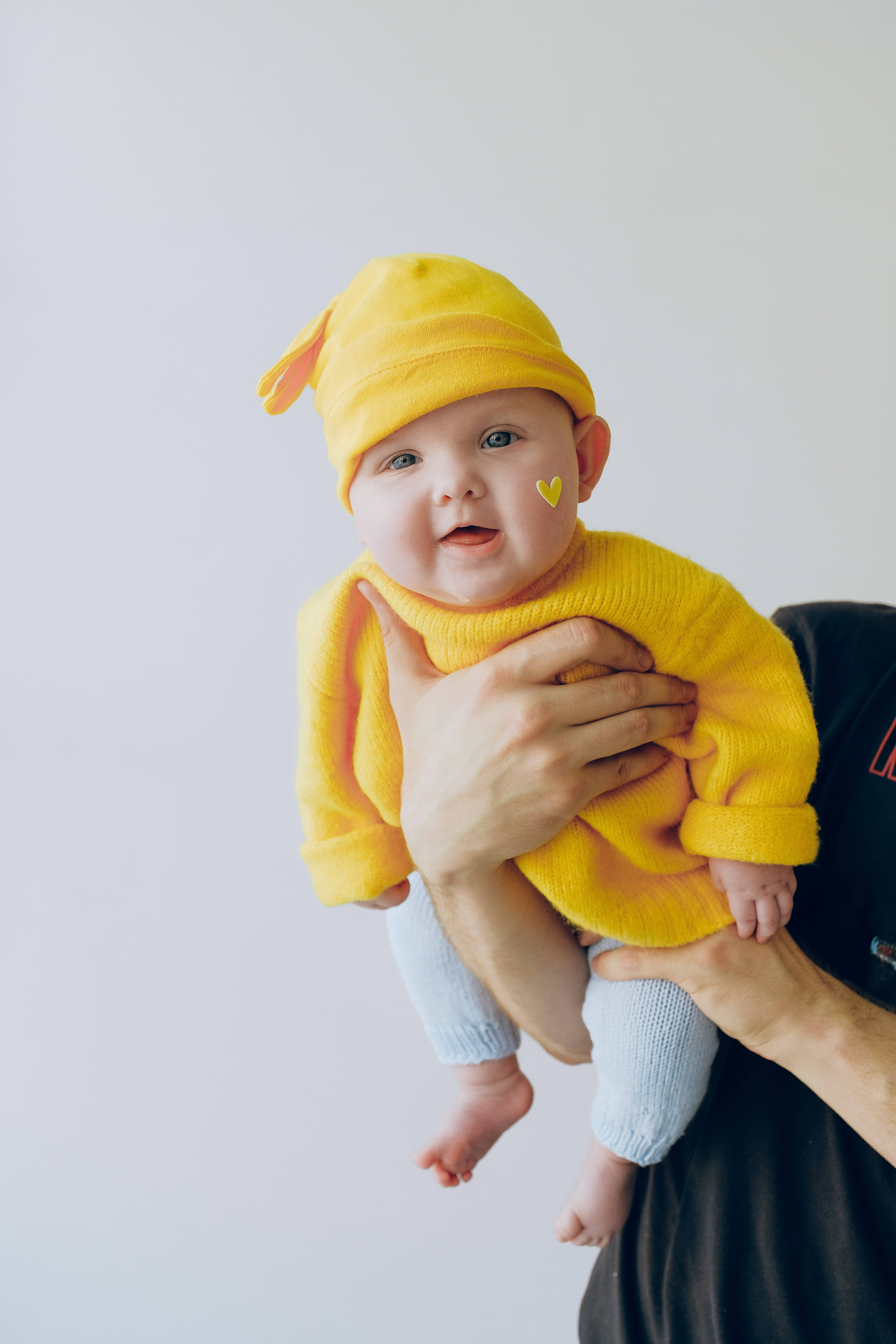 bright yellow knit outfit, hat, plain white background, 5K Phone Wallpaper