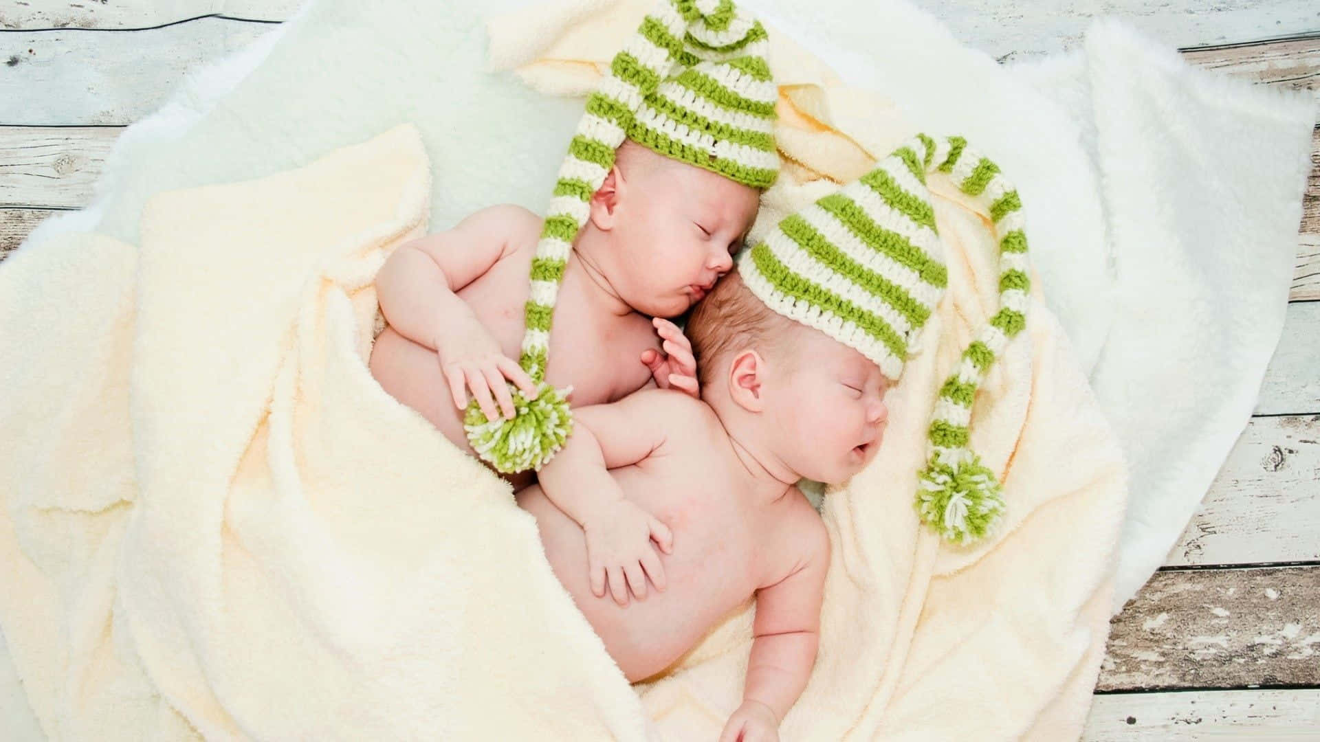 newborn twins, green striped knit hats, soft yellow blanket, Full HD Desktop Wallpaper