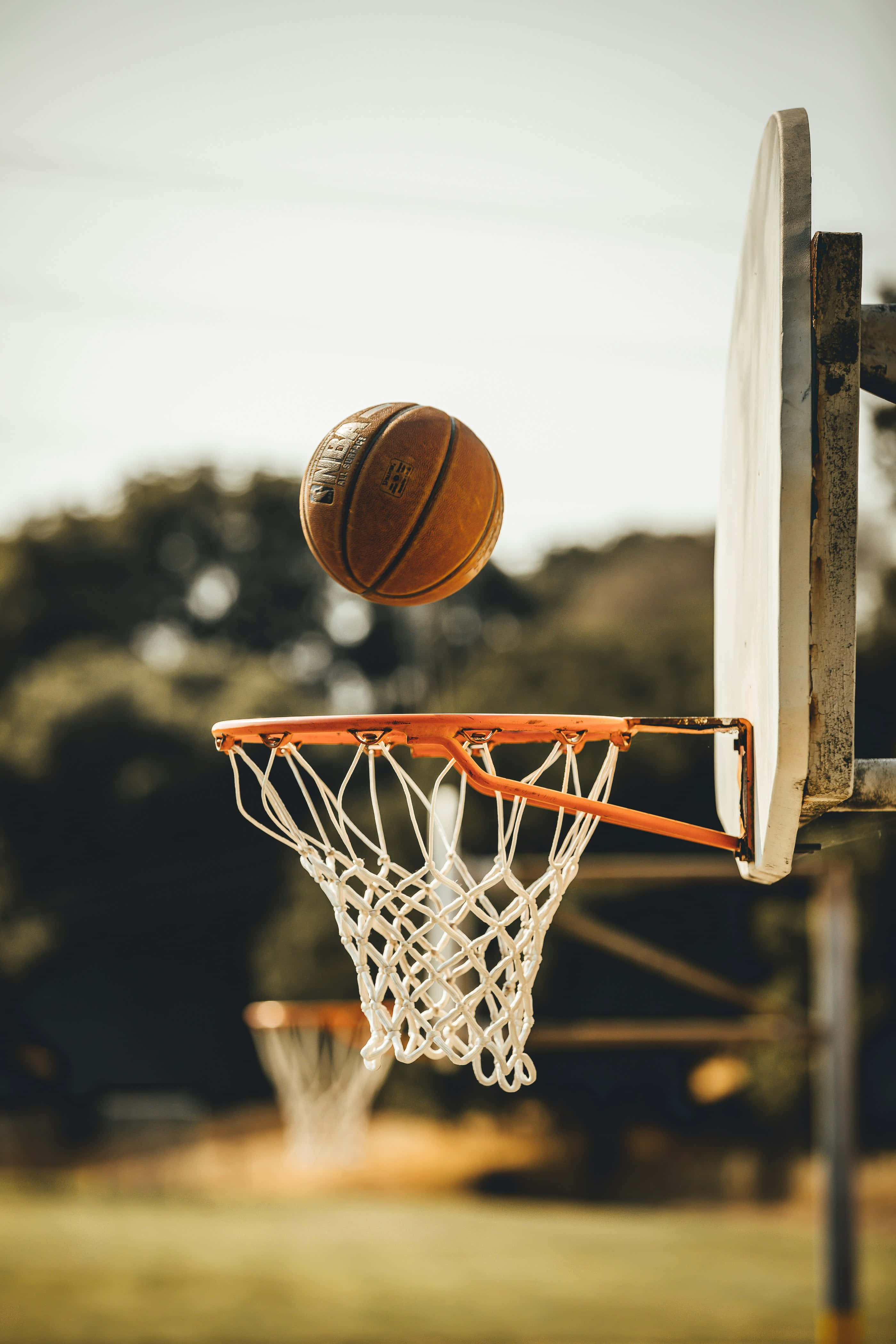 basketball, mid-air, weathered hoop, 4K Phone Wallpaper