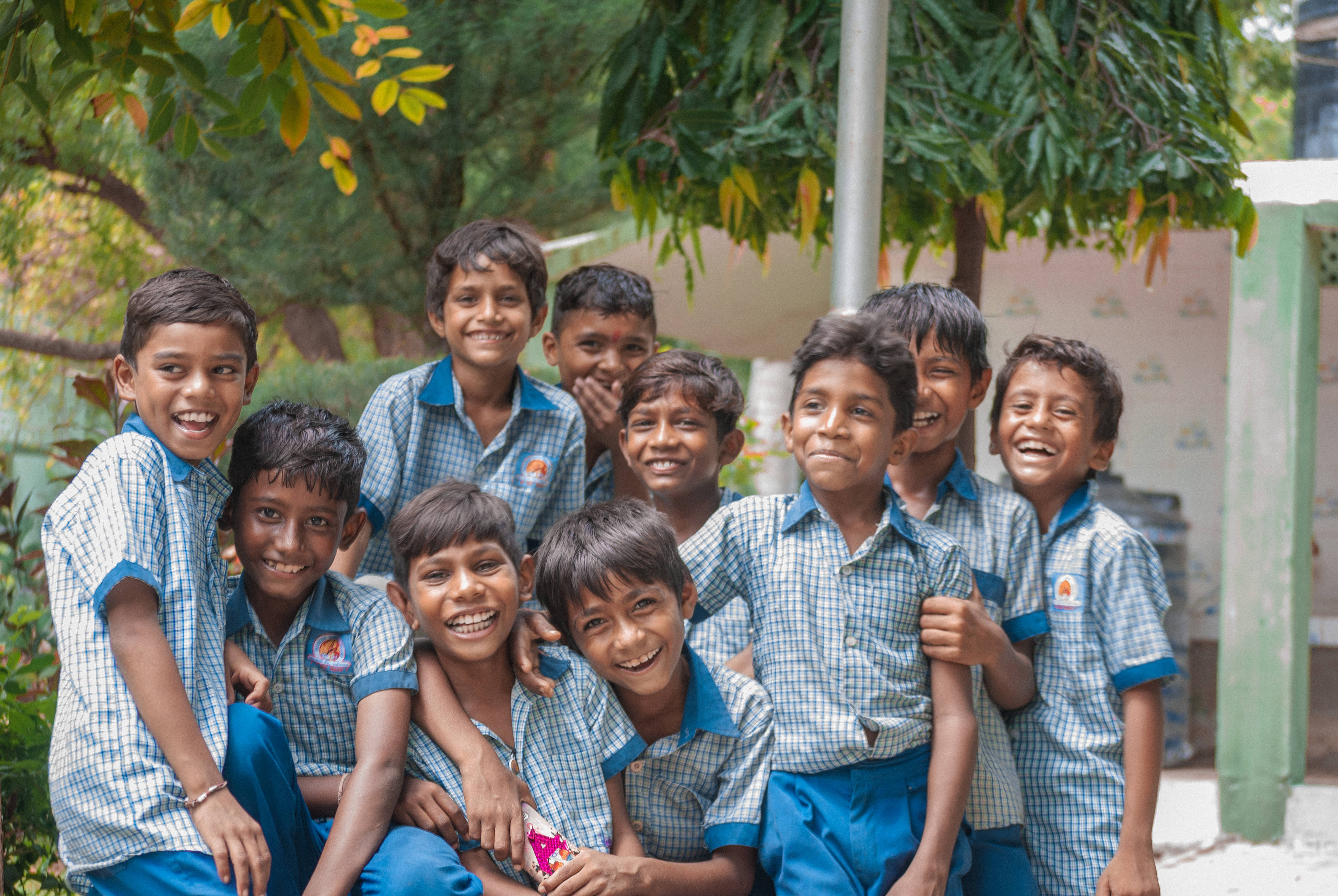 schoolboys, blue checkered uniforms, leafy green trees, 4K Desktop Wallpaper