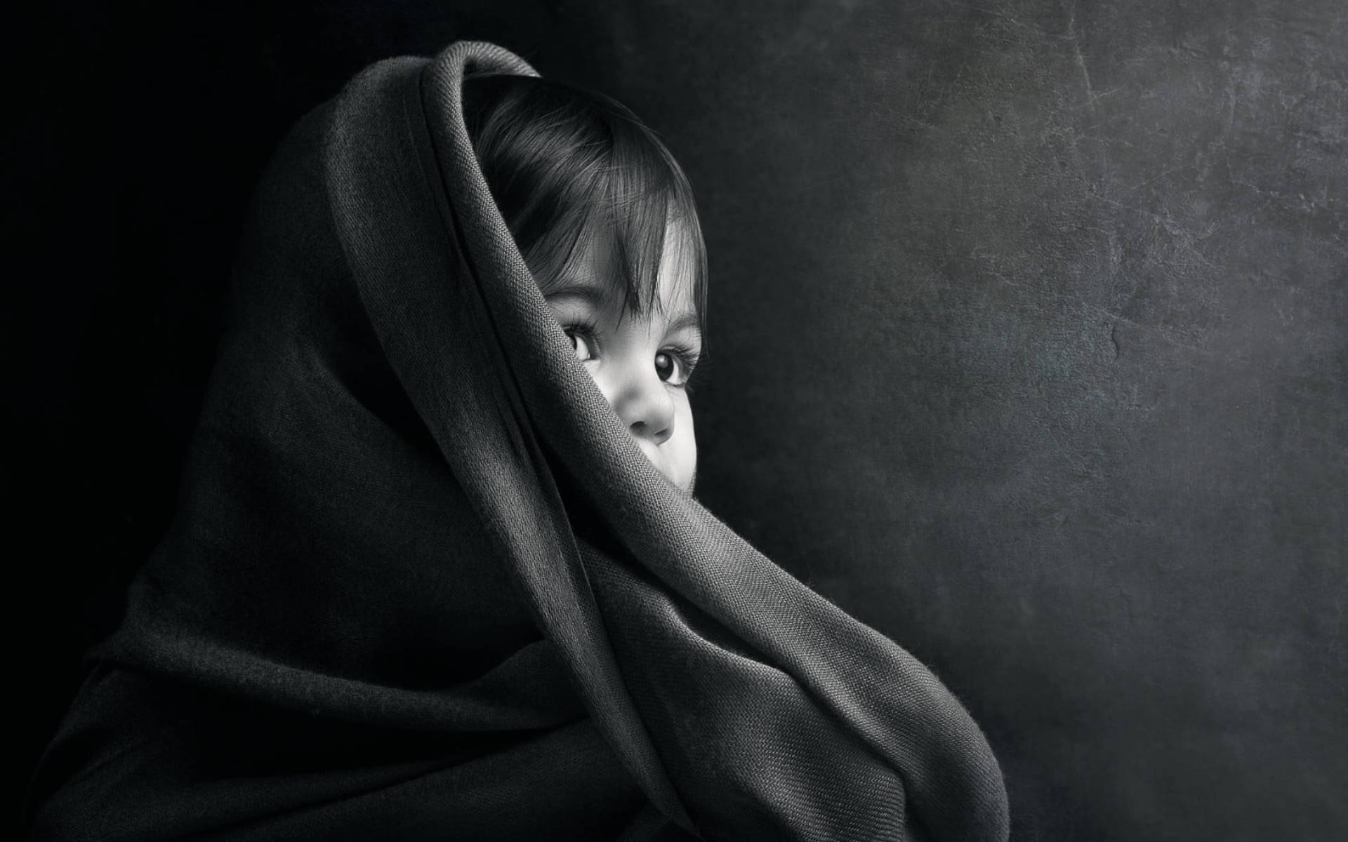 Cute Black Young Kid, dark textured blanket, wide curious eyes, Full HD Desktop Wallpaper