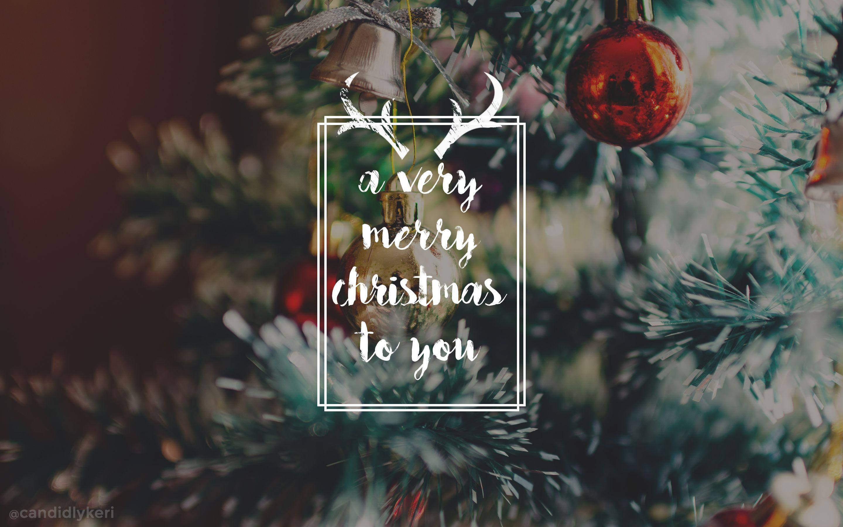 Christmas tree, red ornaments, festive text overlay, 2K Desktop Wallpaper