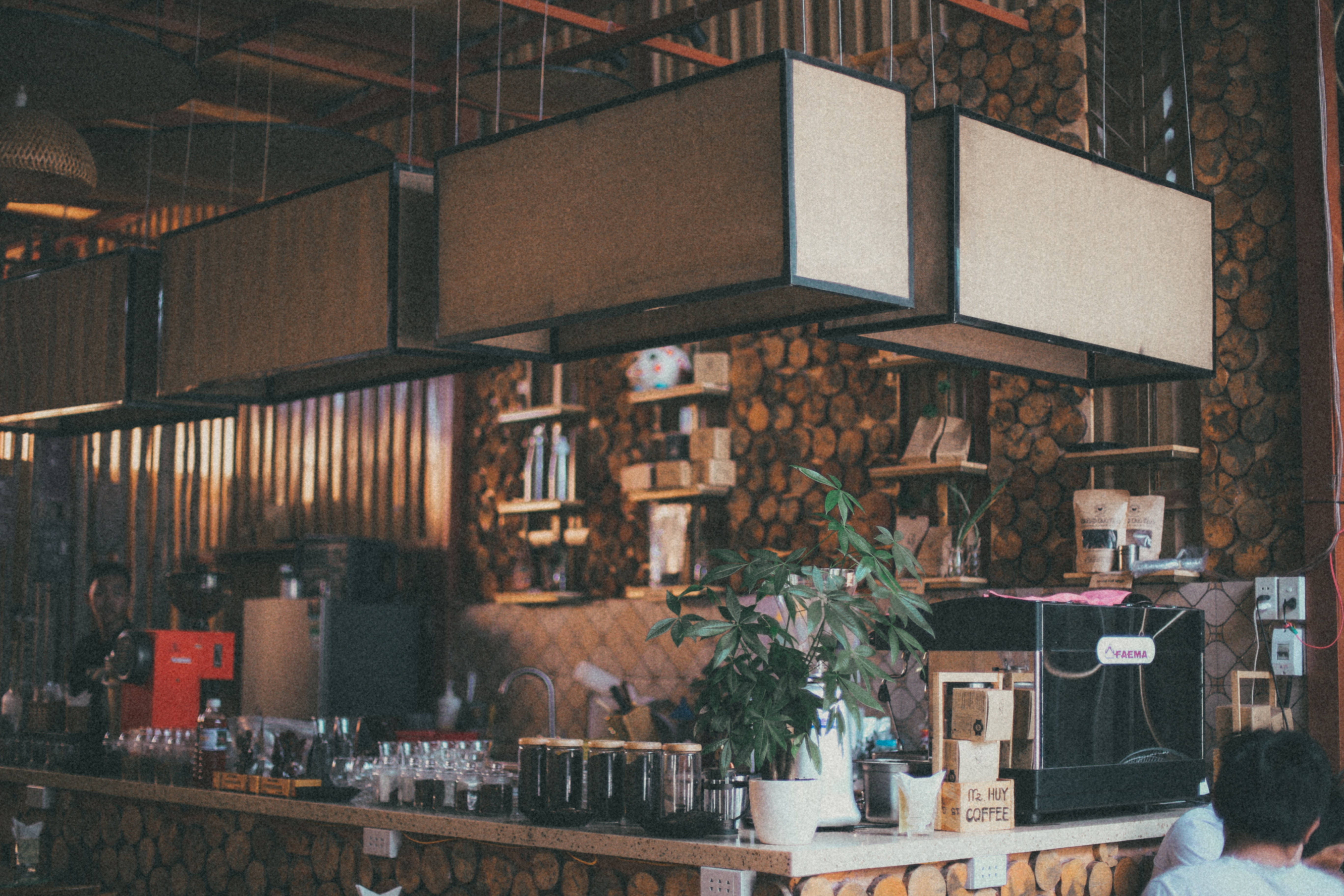 fancy coffee shop interior, wooden log walls, hanging pendant lights, 5K Desktop Wallpaper