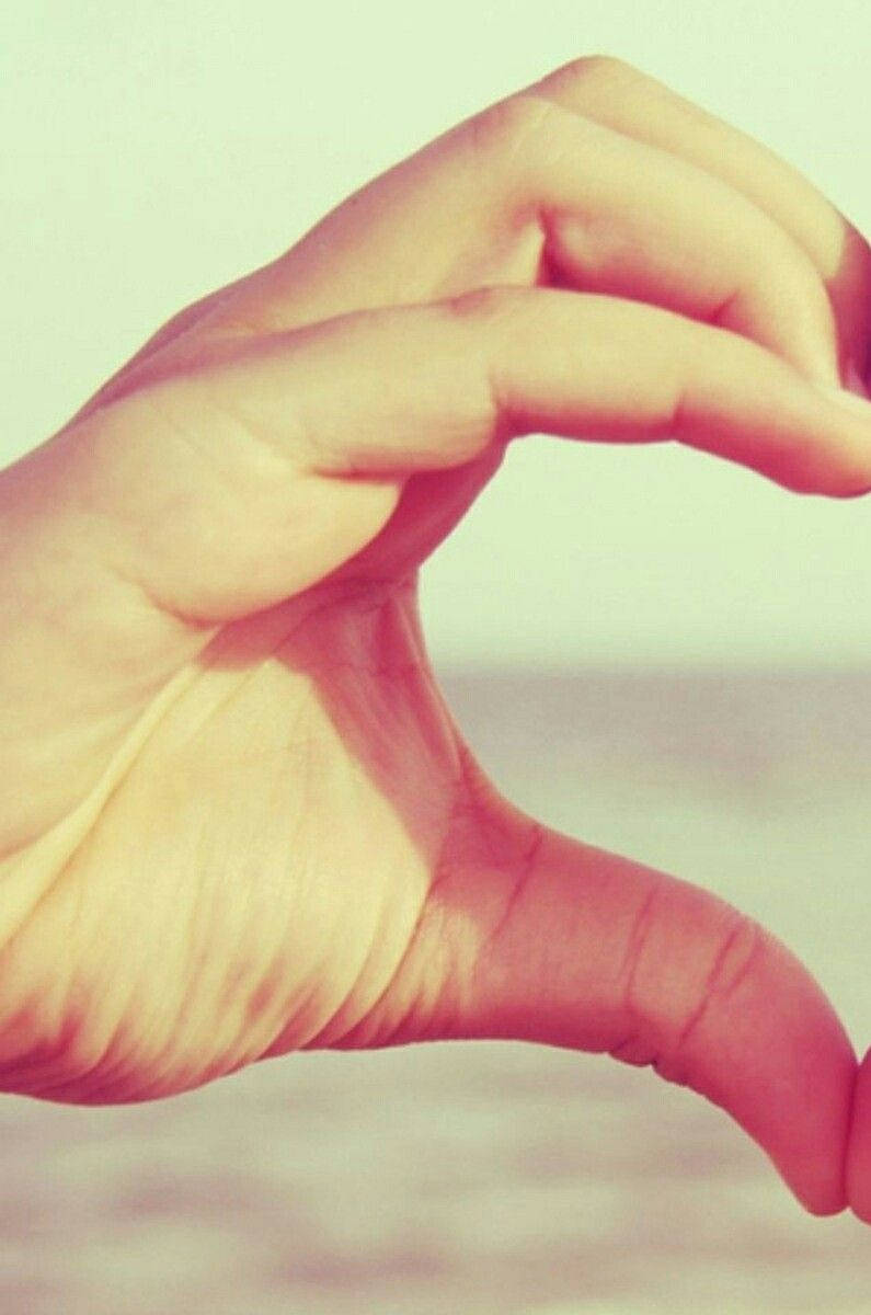 cute couple matching, left hand heart sign, soft blurred background, SD Phone Wallpaper