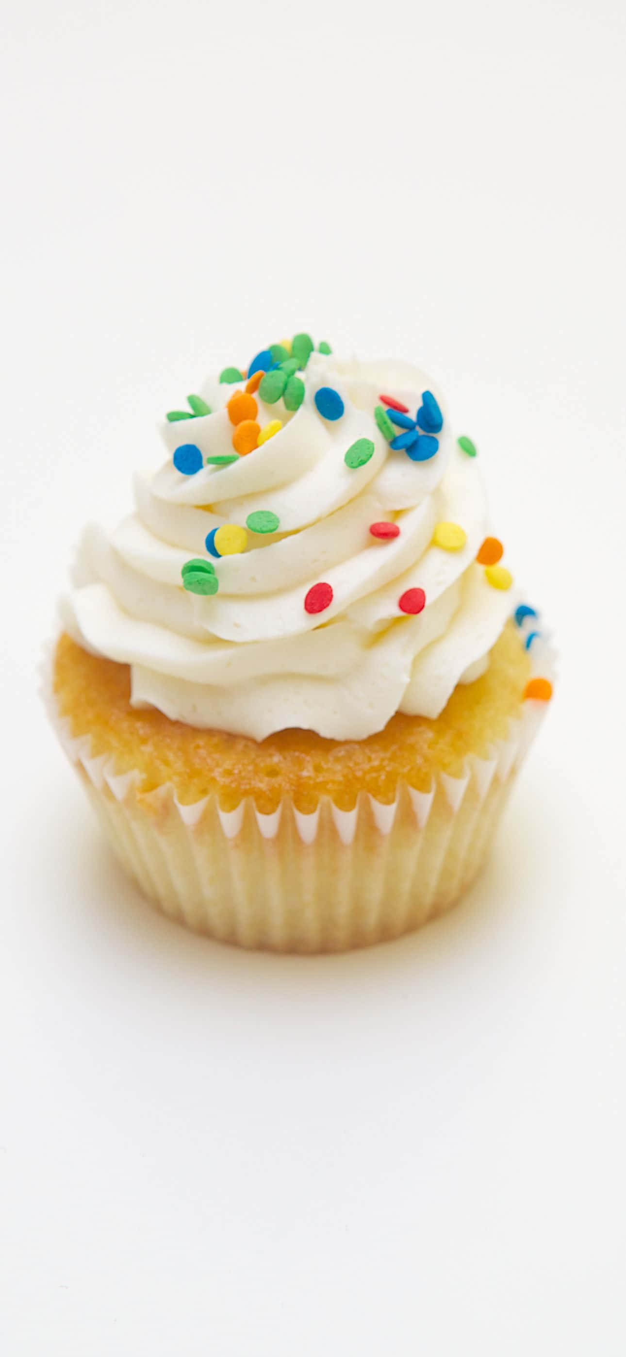 vanilla cupcake, white frosting, colorful sprinkles, 2K Phone Wallpaper
