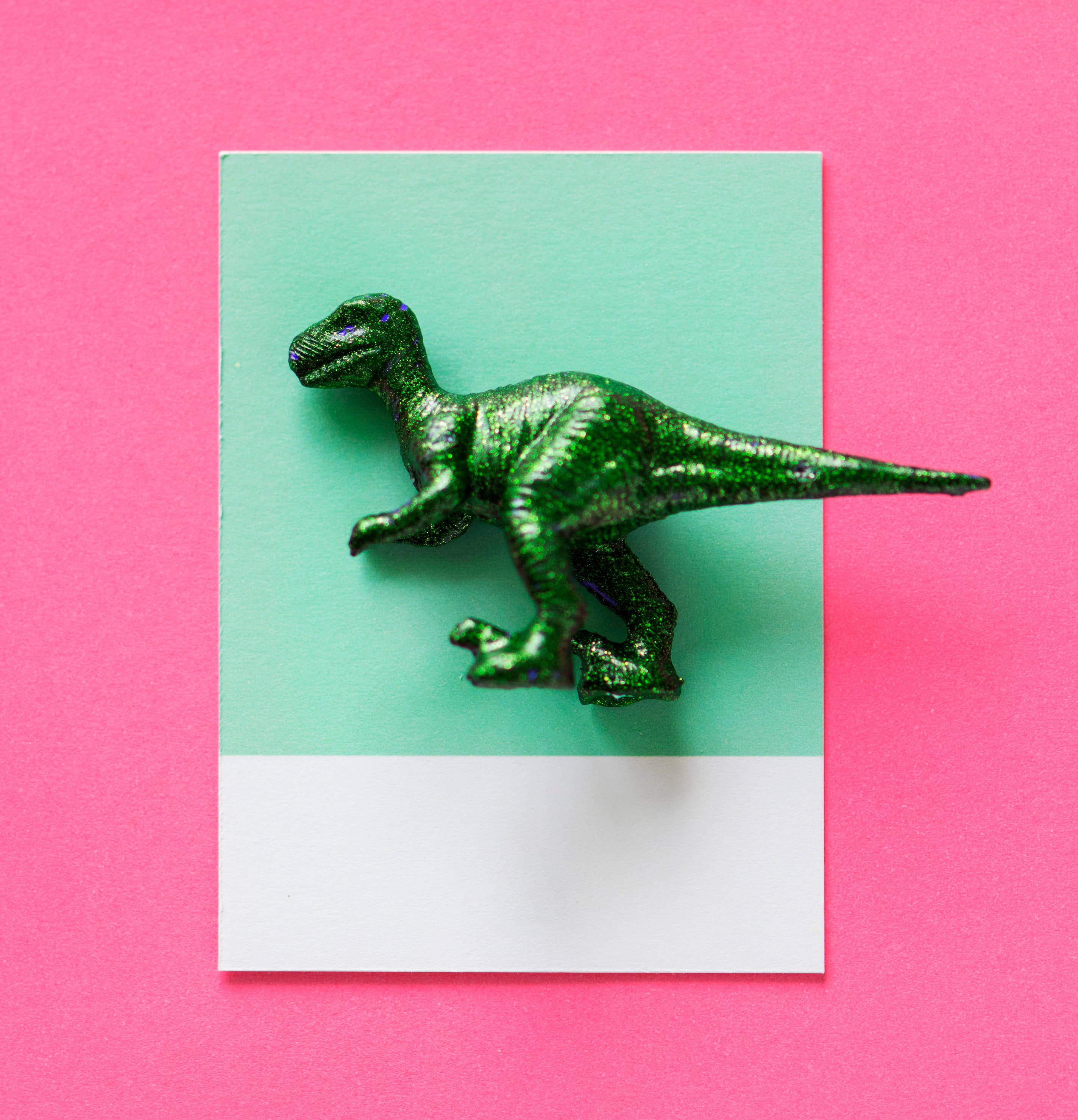 cute pink dinosaur, mint paper, glittery green plastic dinosaur toy, 2K Phone Wallpaper