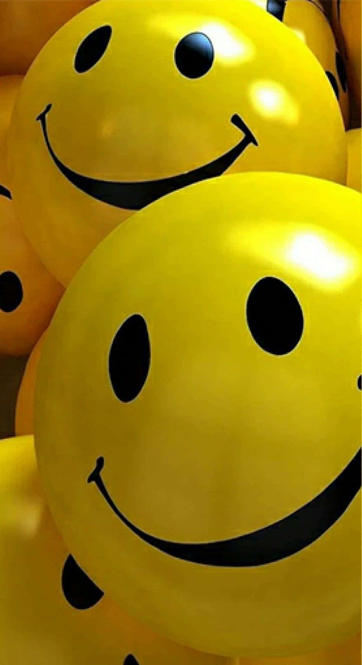bright yellow balloons, bold black smiley faces, warm light, Full HD Phone Wallpaper