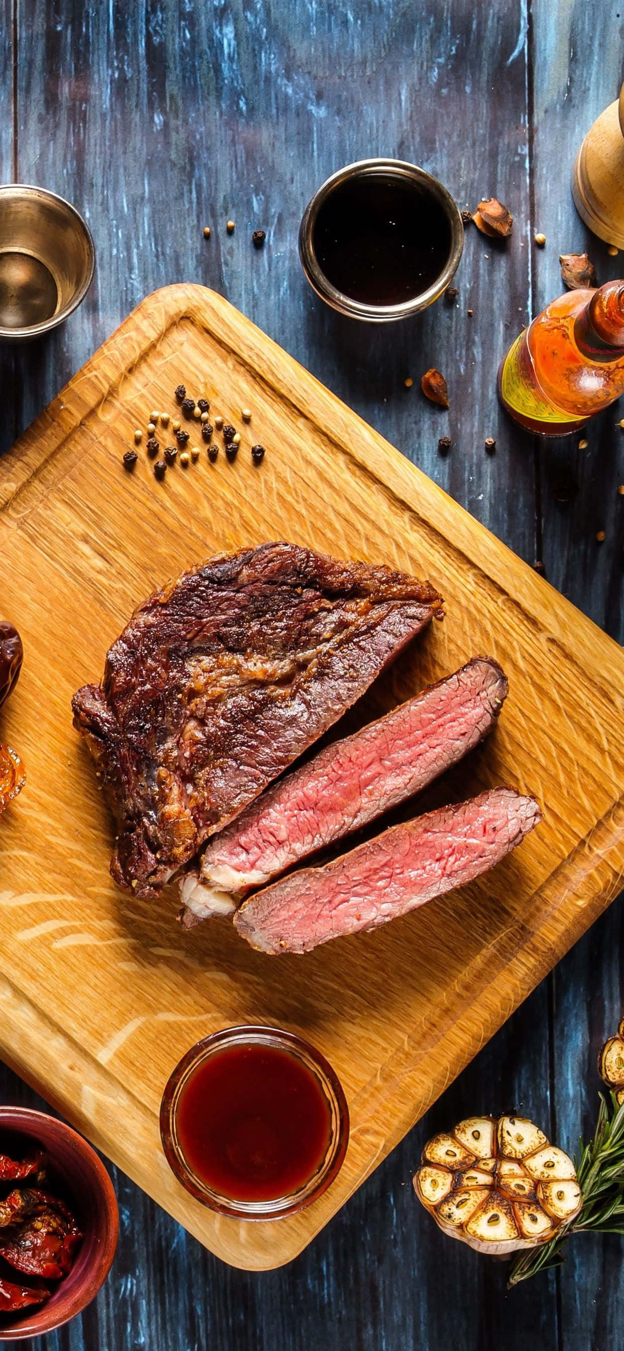 medium-rare steak, wooden board, garlic rosemary, 2K Phone Wallpaper