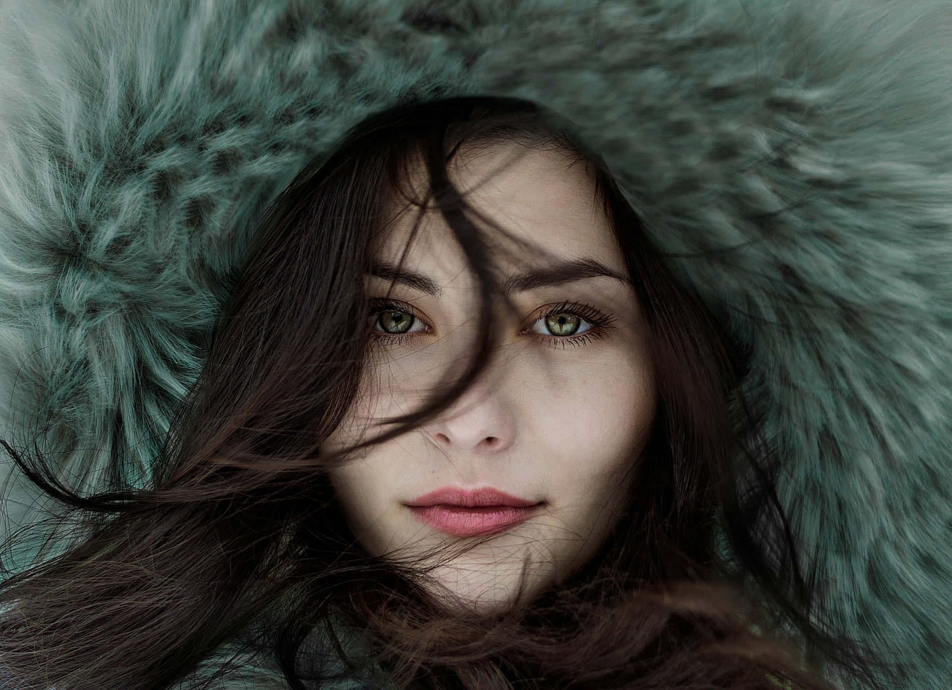 teal fur-lined hood, green eyes, dark hair, Full HD Desktop Wallpaper