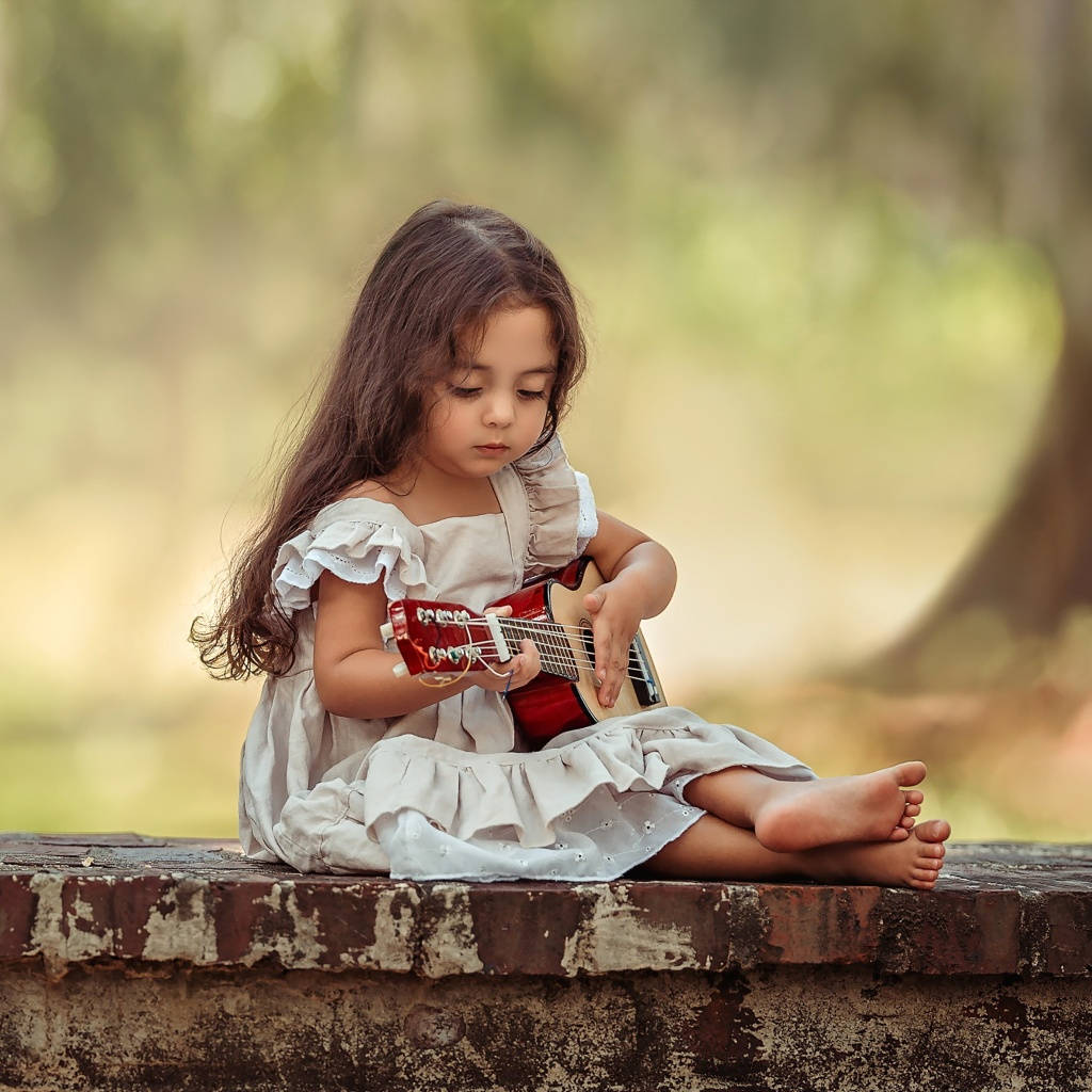 red and natural wood ukulele, long dark hair, barefoot, SD Desktop Wallpaper