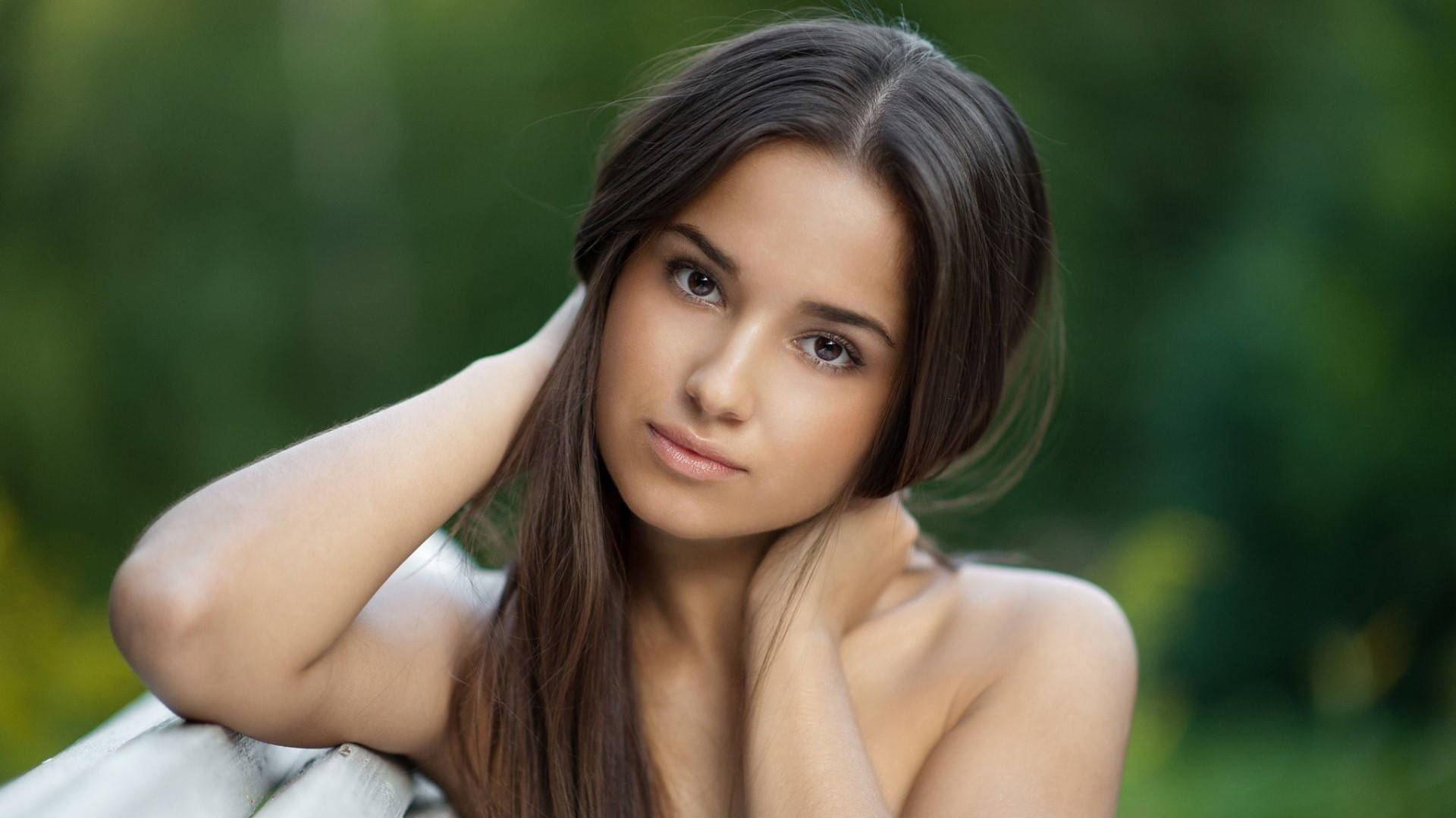 young woman, long brown hair, blurred green foliage background, Full HD Desktop Wallpaper