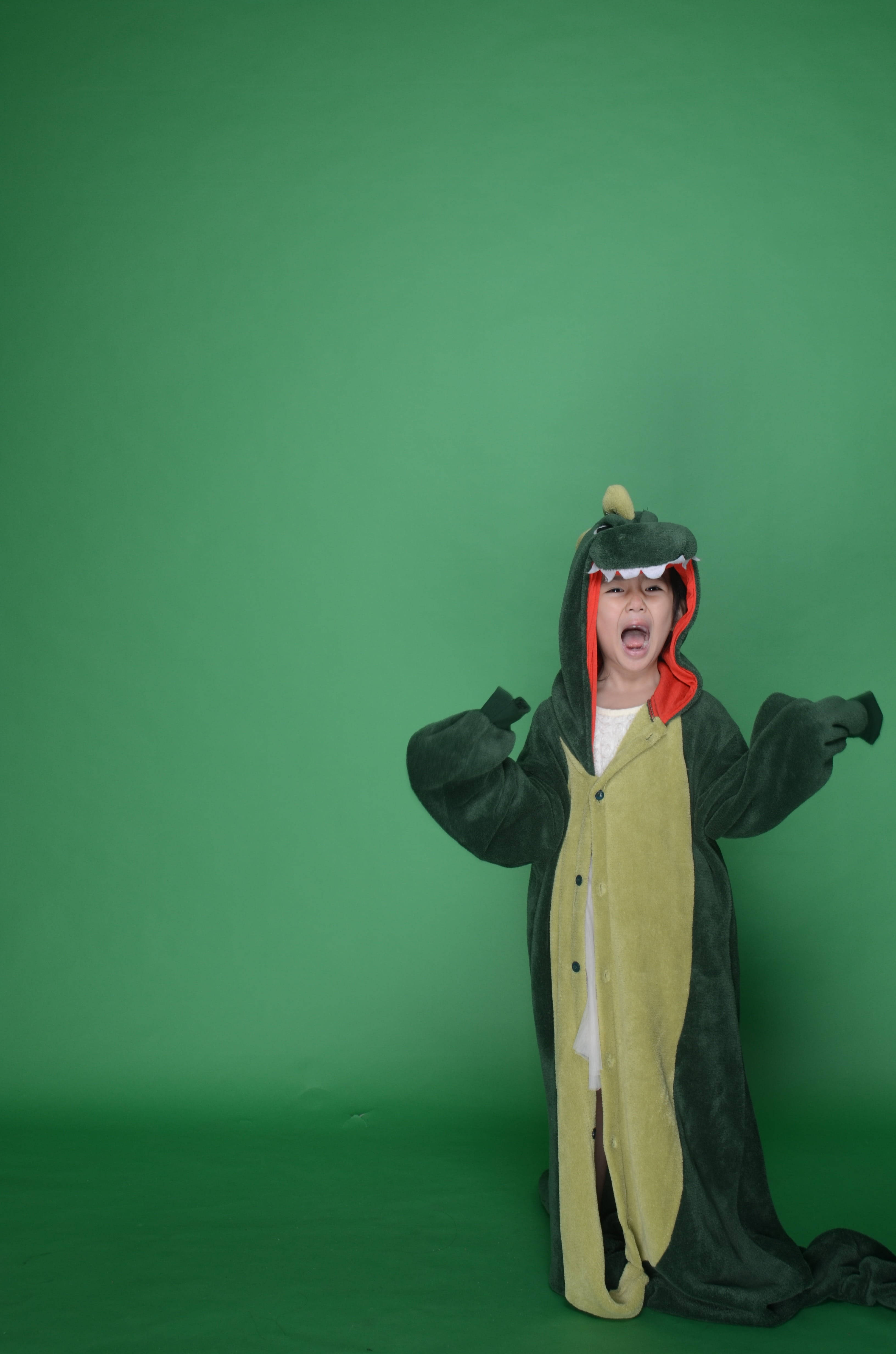 green and yellow dinosaur onesie, child, solid green screen background, 4K Phone Wallpaper