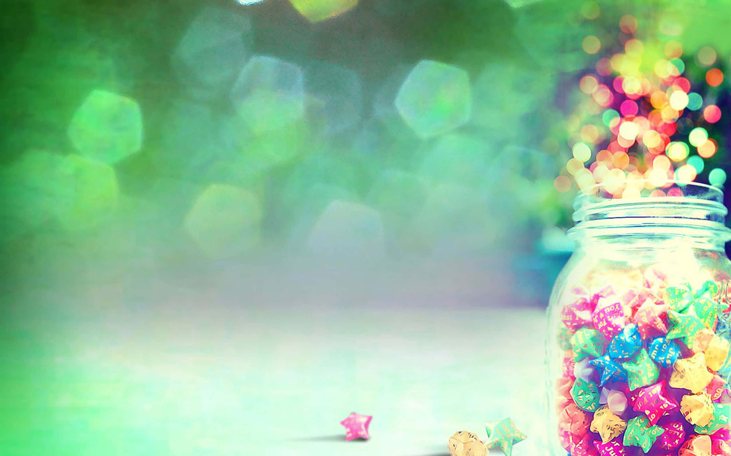 glass jar, colorful star-shaped candies, dreamy green bokeh background, 2K Desktop Wallpaper
