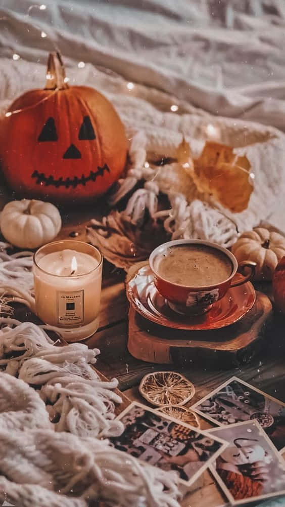 Fall Halloween iPhone, cozy autumnal scene, carved pumpkin candle, SD Phone Wallpaper