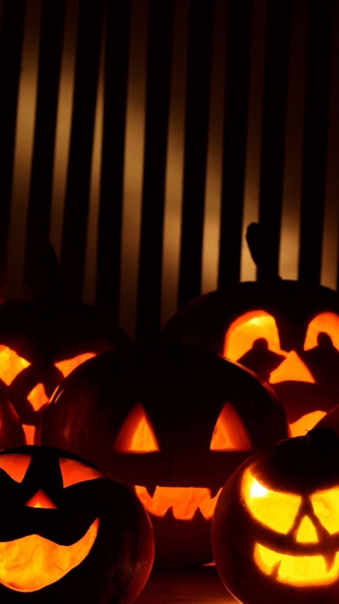 jack-o'-lantern, carved faces, warm orange light, Full HD Phone Wallpaper