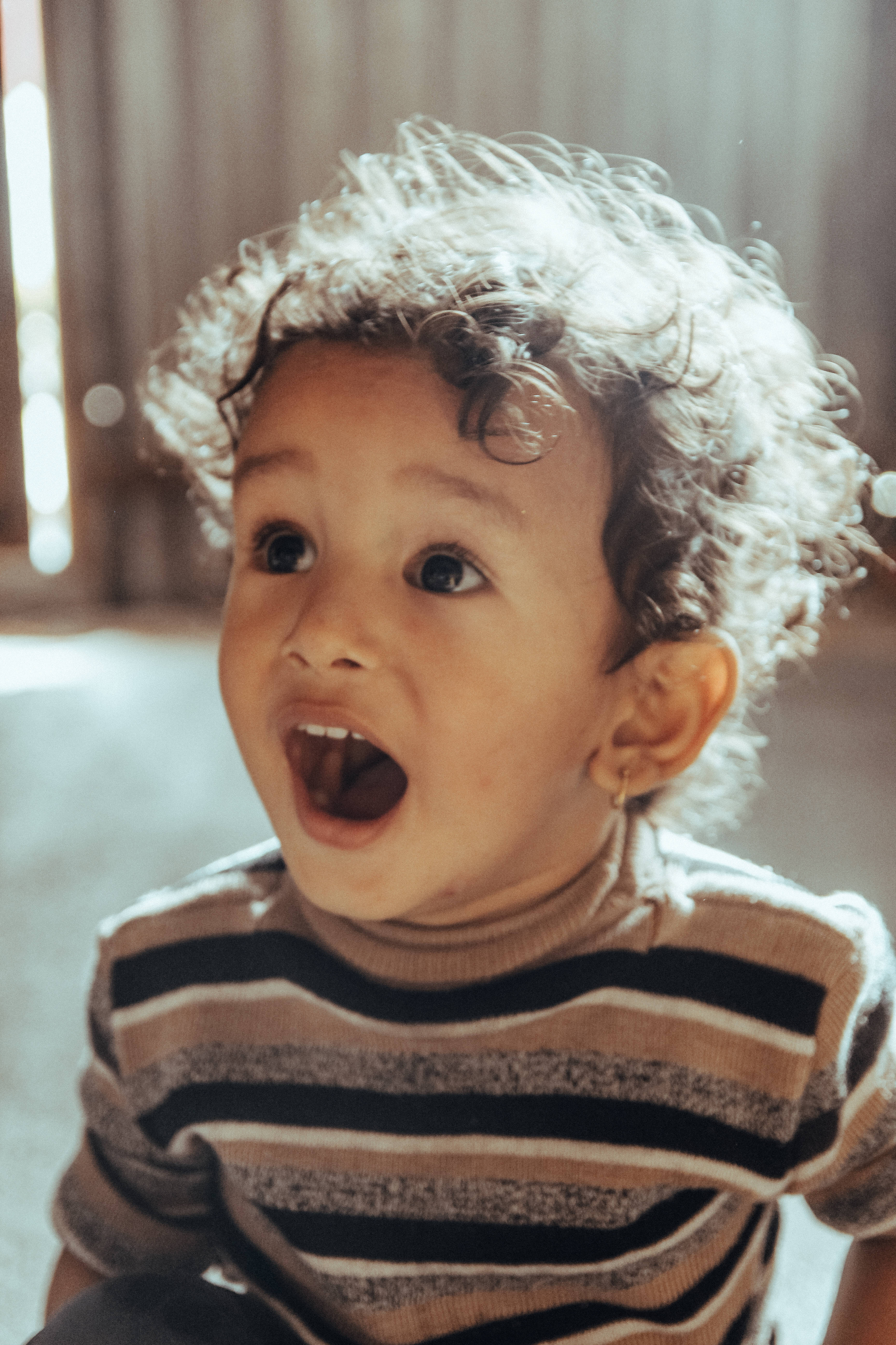 surprised boy, curly hair, wide eyes, 5K Phone Wallpaper