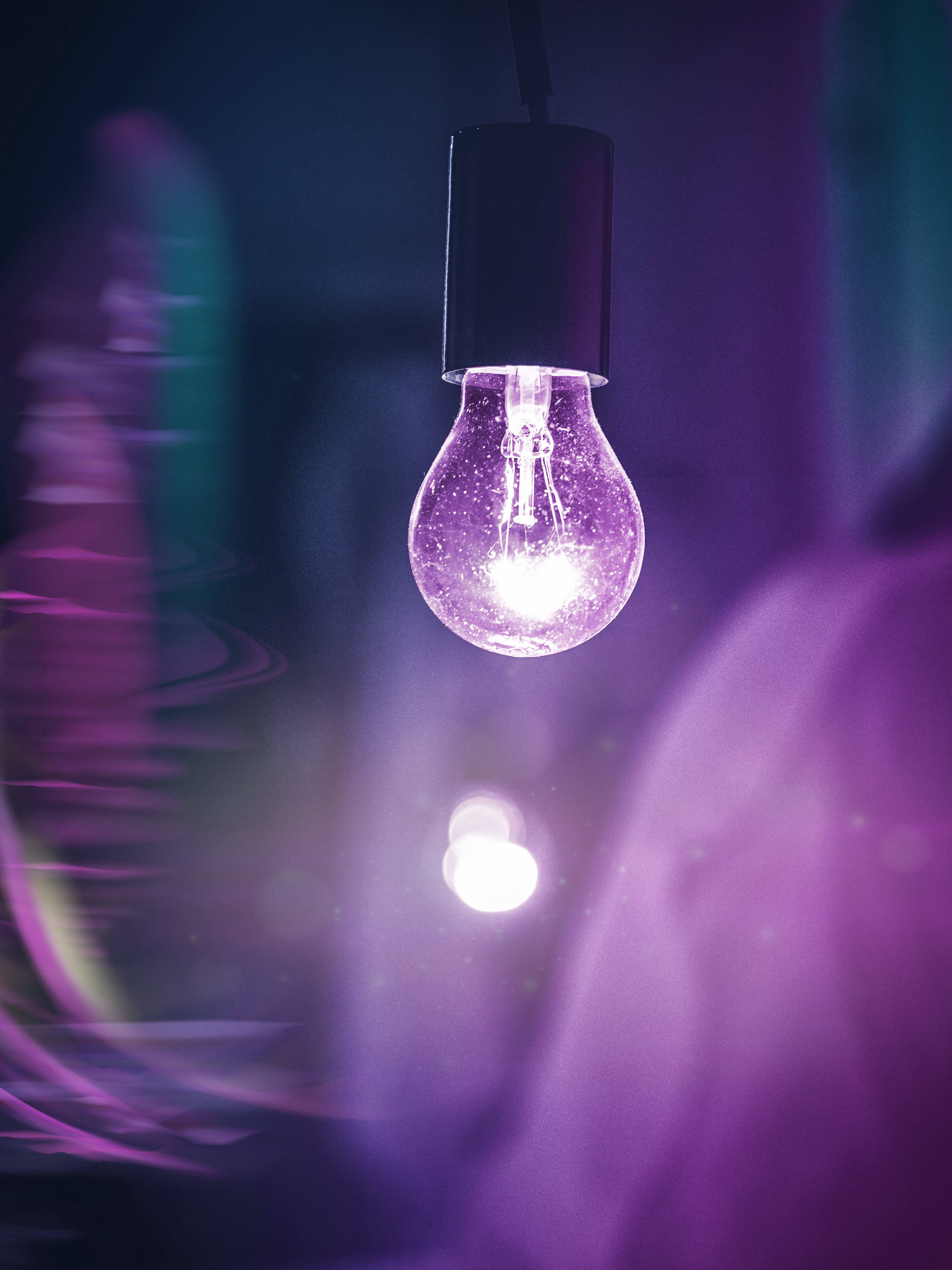neon purple aesthetic lightbulb, glowing purple vintage light bulb, blurred colorful background, 2K Phone Wallpaper