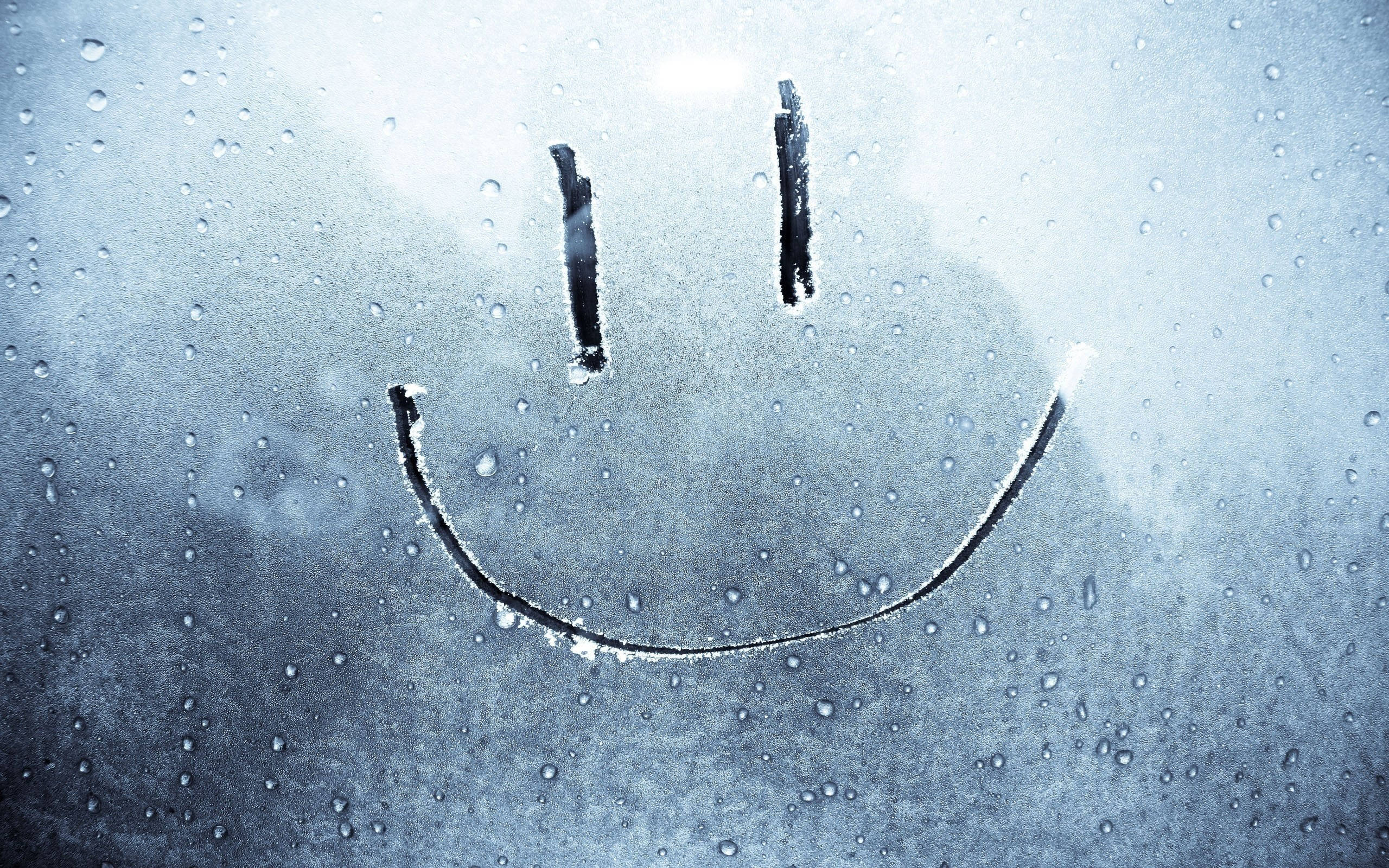 MacBook Air, frosted glass, rain-speckled window, 2K Desktop Wallpaper