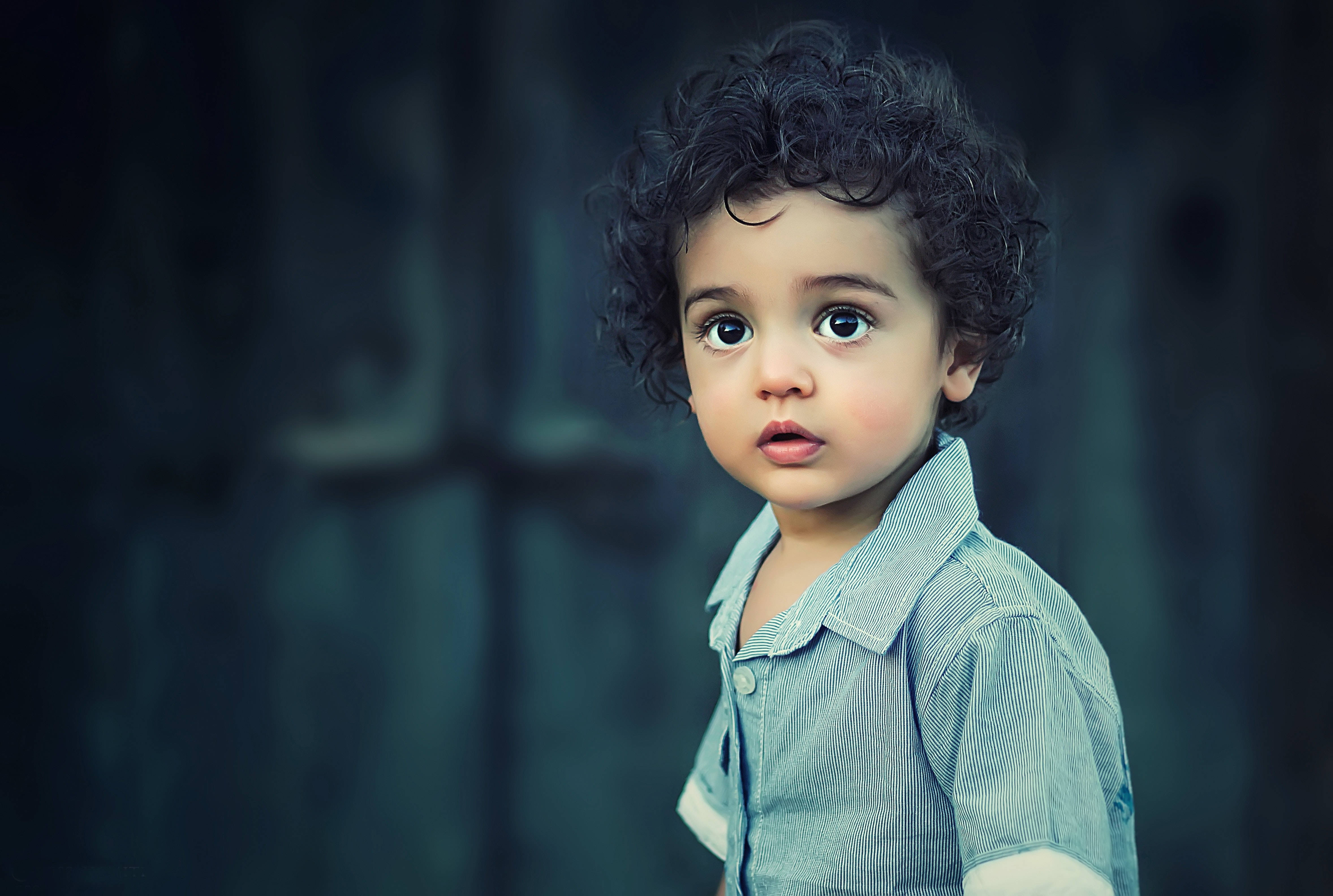 cute baby, black curly hair, wide eyes, 4K Desktop Wallpaper