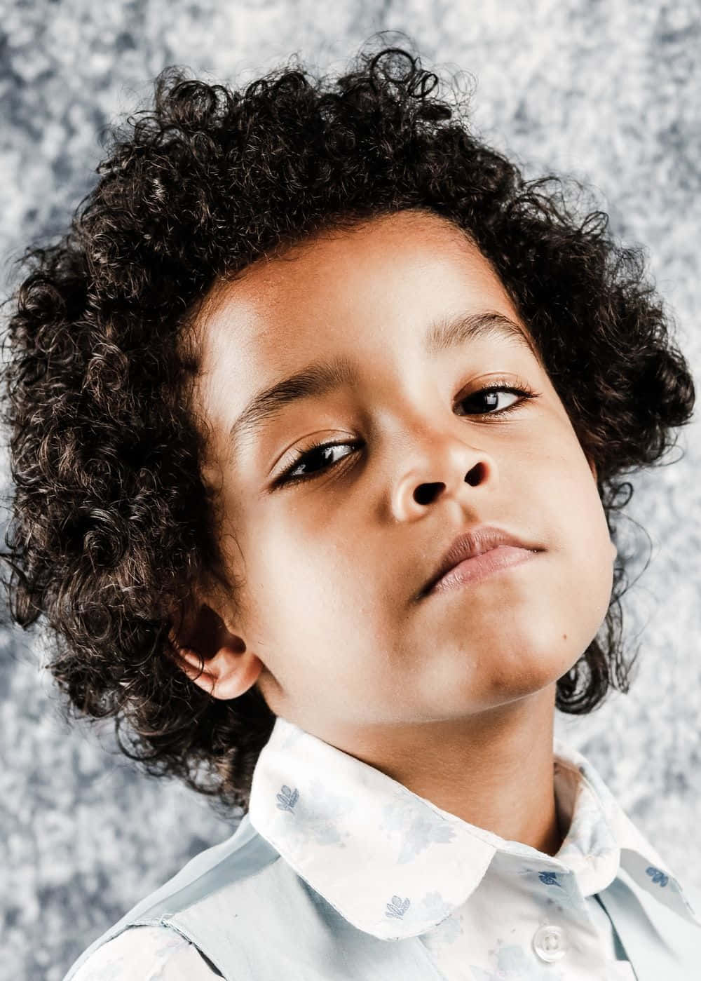 confident young boy, curly dark hair, thoughtful expression, HD Phone Wallpaper