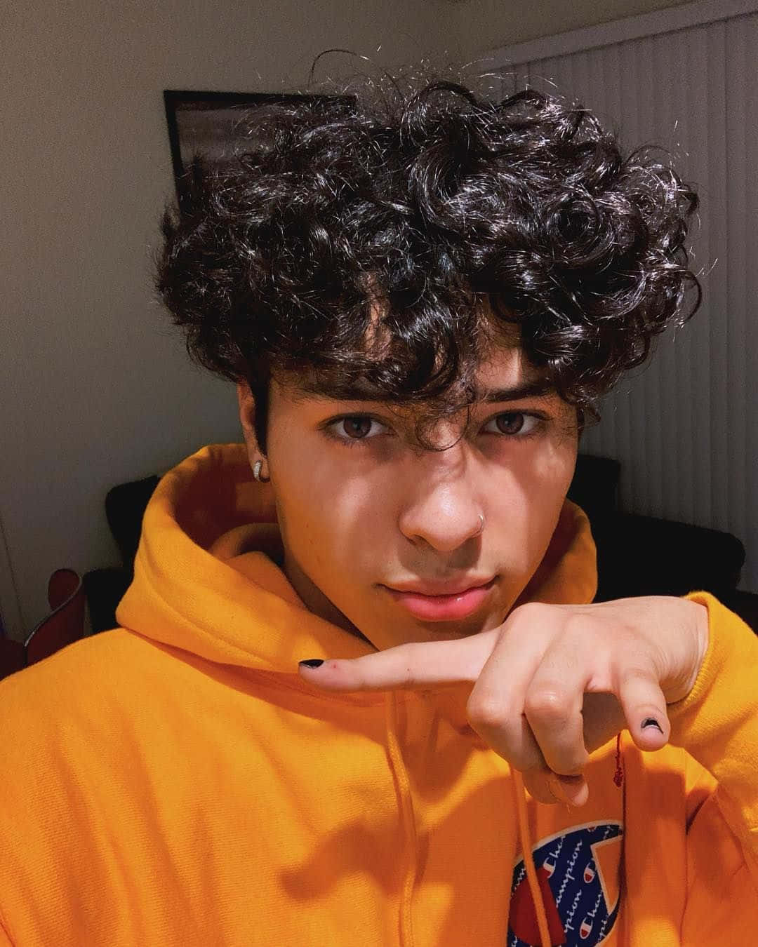 curly haired boy, orange hoodie, dark curly hair, HD Phone Wallpaper
