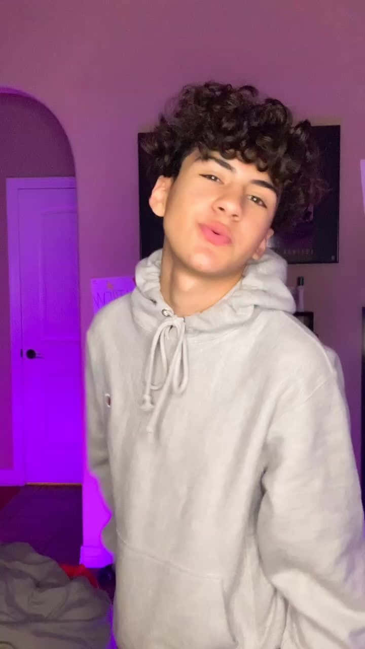 curly dark hair, light gray hoodie, purple lit bedroom, HD Phone Wallpaper