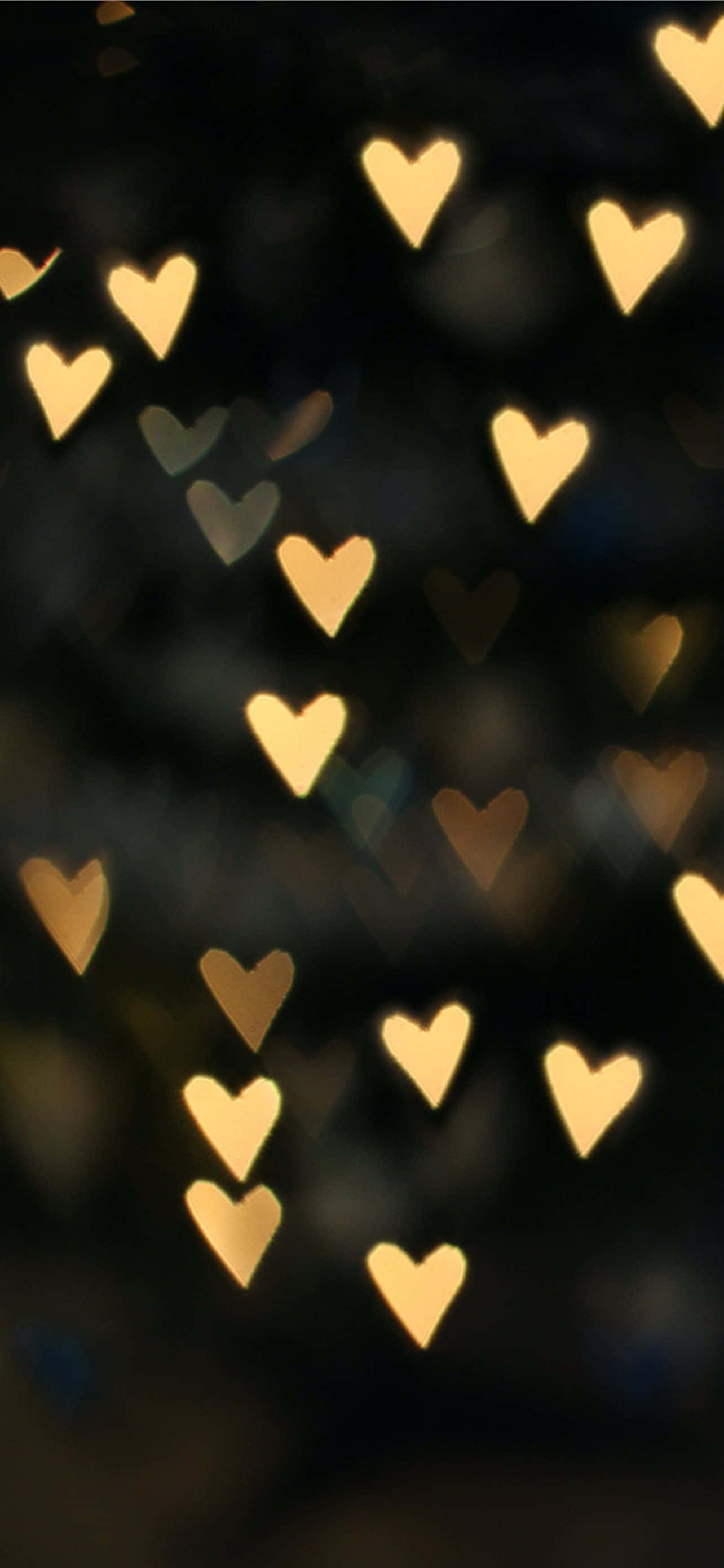 golden heart-shaped bokeh lights, dark background, romantic, 2K Phone Wallpaper