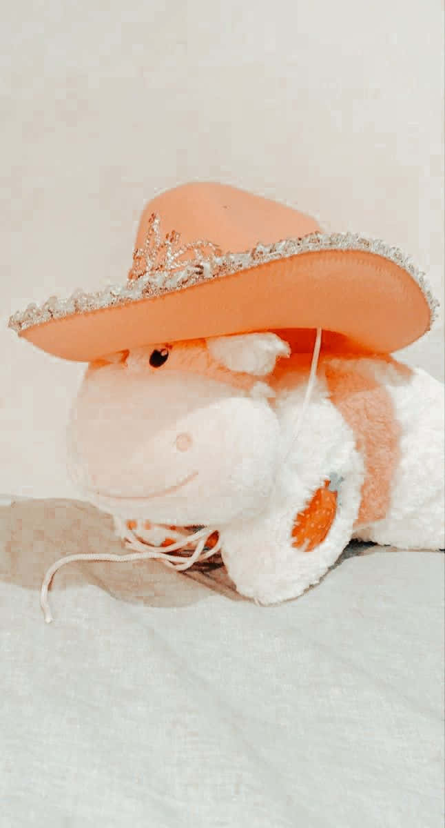 plush cow, peach cowboy hat, silver trim, SD Phone Wallpaper