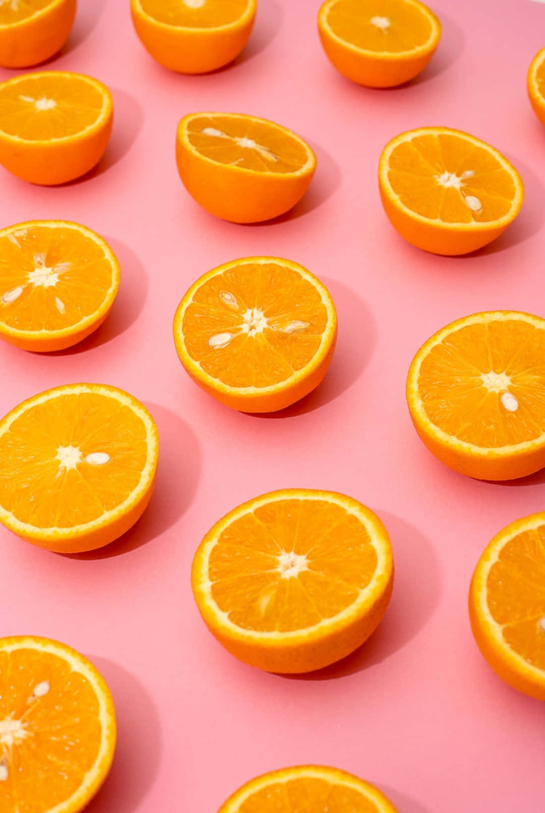 Vibrant Orangeson Pink Background, orange halves, neat grid, HD Phone Wallpaper
