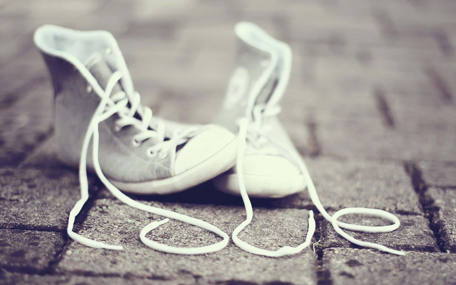 white high-top sneakers, untied laces, weathered cobblestone street, Full HD Desktop Wallpaper