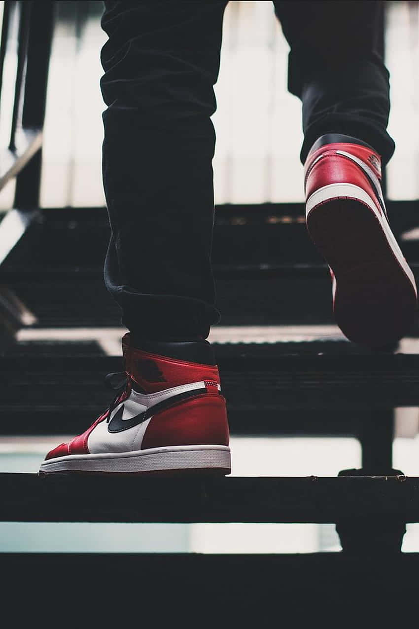 red and white high-top sneakers, dark stairs, soft backlighting, SD Phone Wallpaper