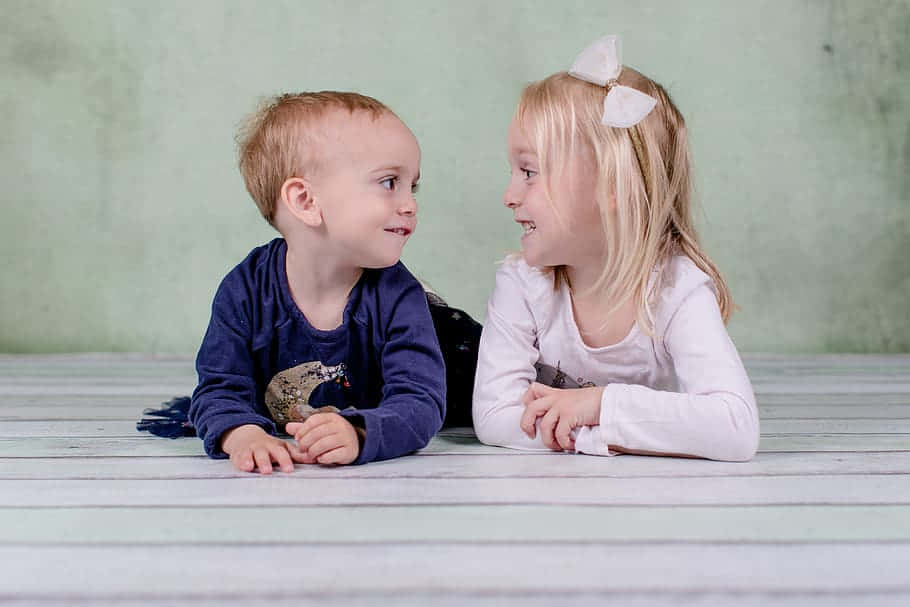 cute sister, boy, light wooden floor, SD Desktop Wallpaper