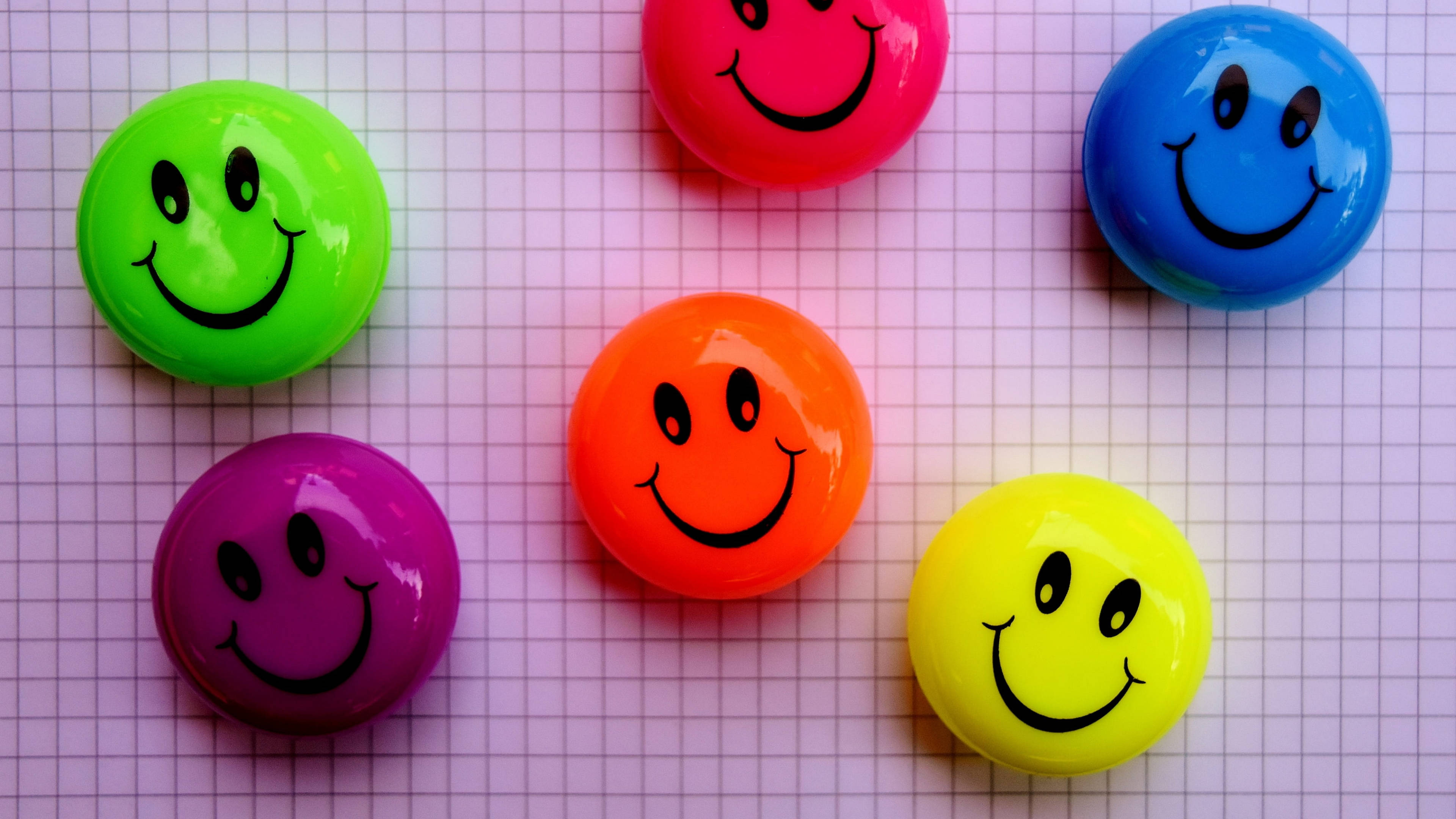 colorful cute smile decoration, glossy colorful smiley face buttons, light purple graph paper background, 4K Desktop Wallpaper