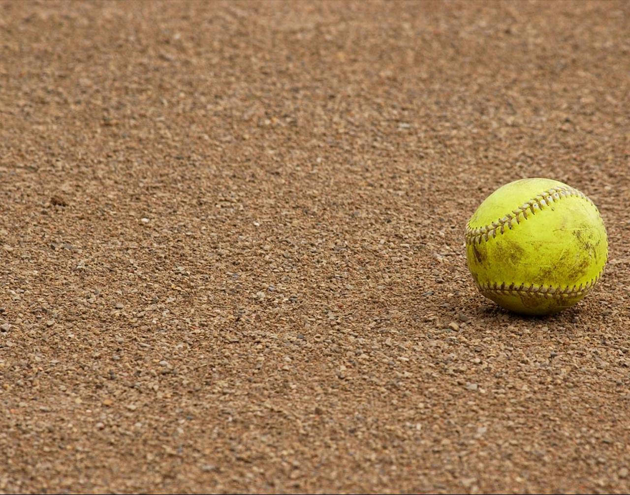 yellow softball, textured brown dirt field, bright daylight, HD Desktop Wallpaper