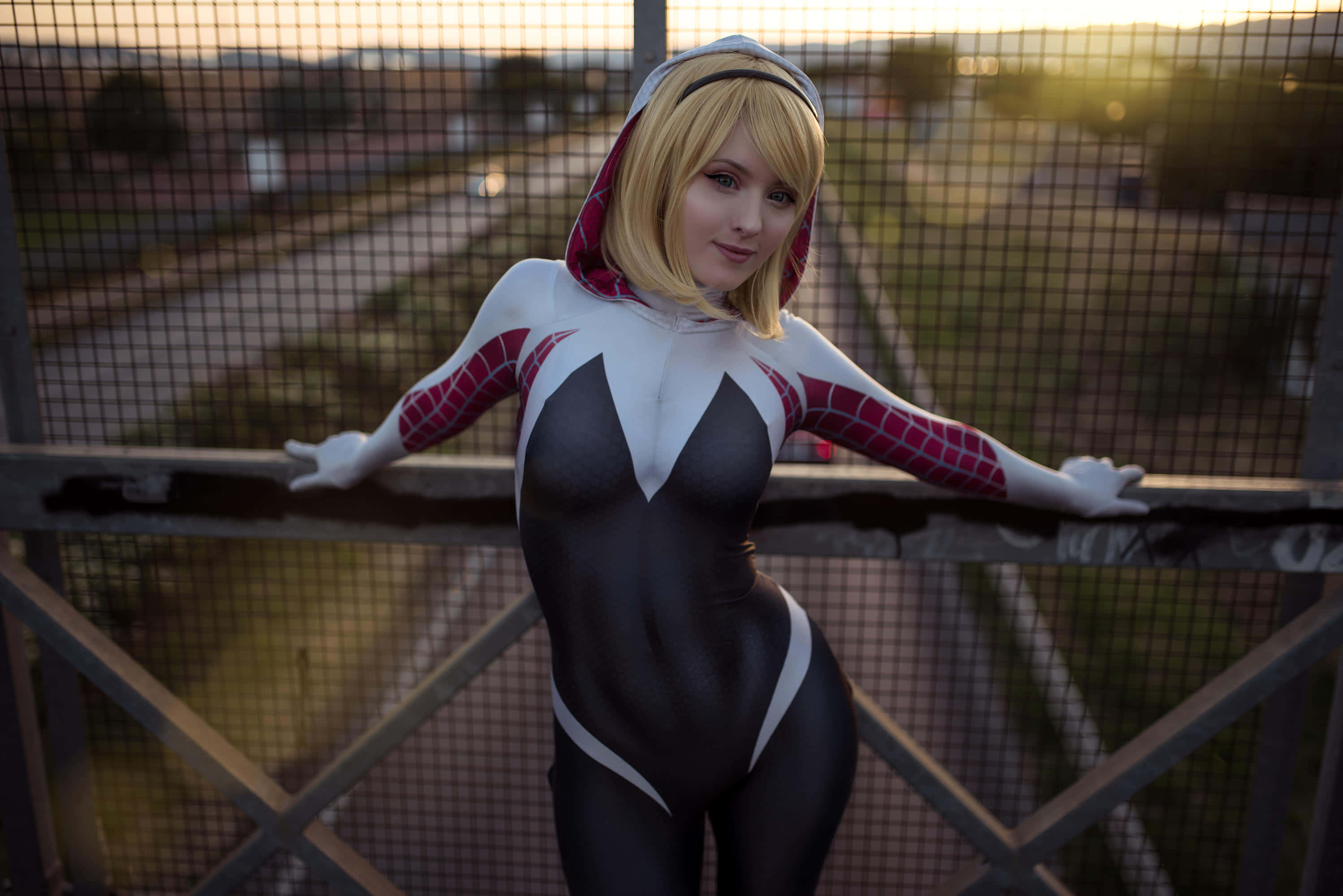 Spider Gwen, black white and red spider-themed suit, metal bridge railing, 2K Desktop Wallpaper