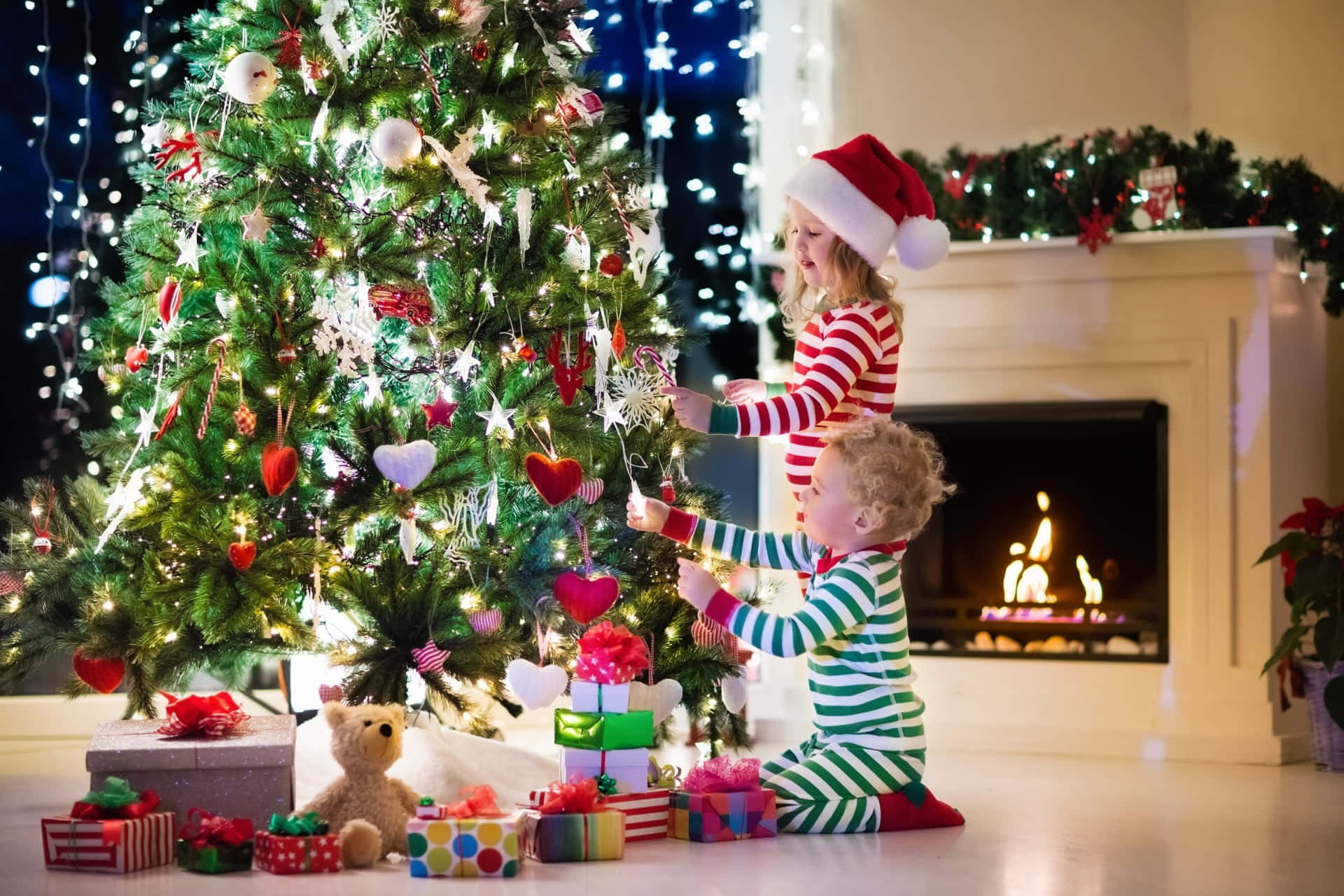 Cute Toddlers, festive pajamas, brightly lit Christmas tree, Full HD Desktop Wallpaper