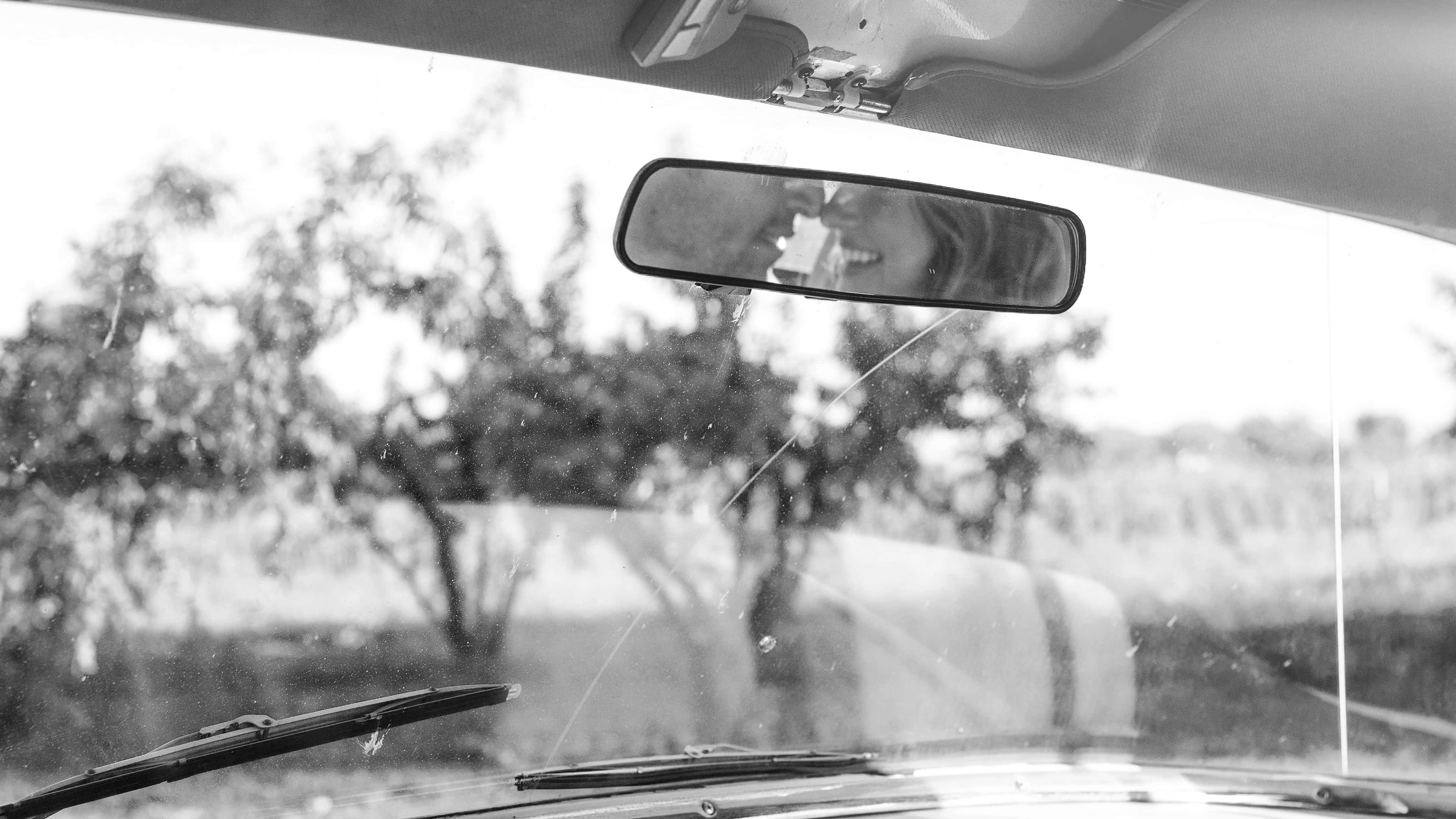 black and white, inside a car, smiling person, 4K Desktop Wallpaper