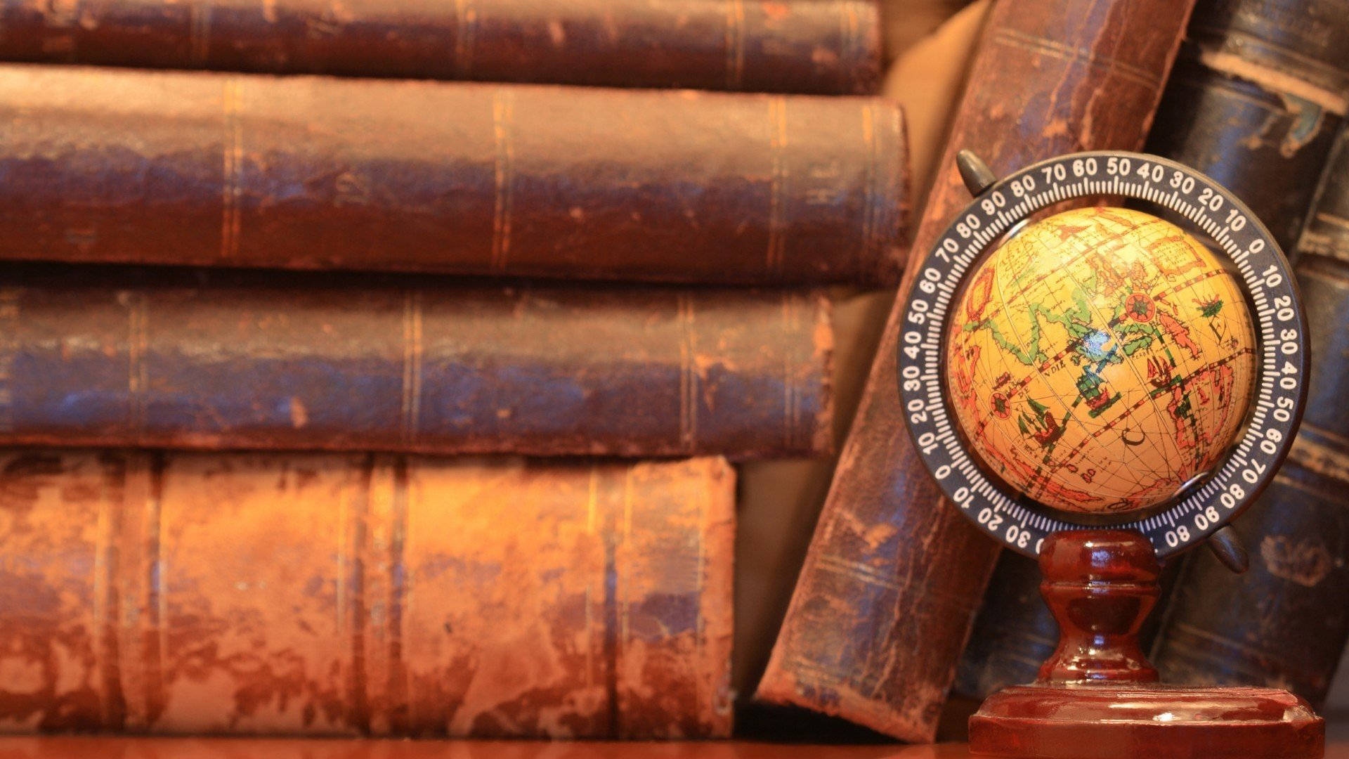 vintage globe, leather-bound books, warmly lit study, Full HD Desktop Wallpaper