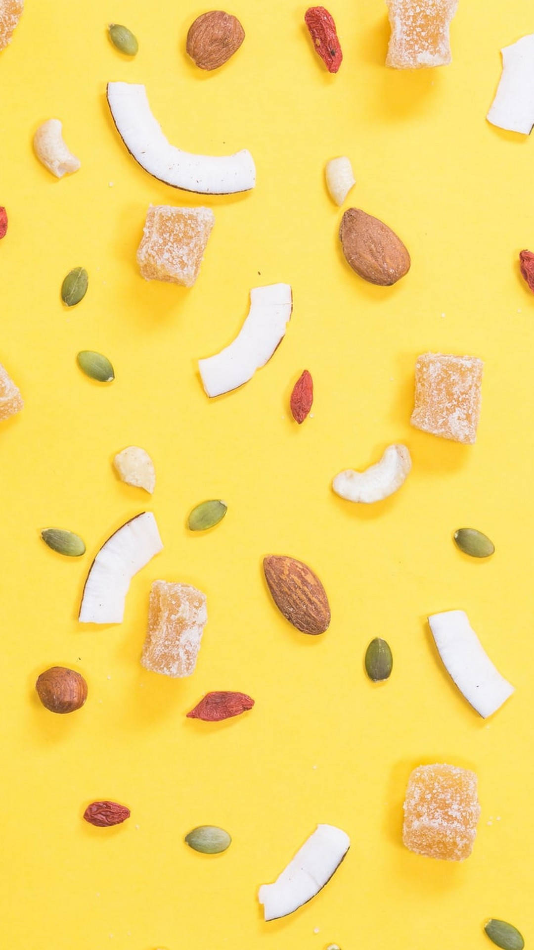 bright yellow background, vibrant flat lay, assorted dried fruits nuts and seeds, Full HD Phone Wallpaper