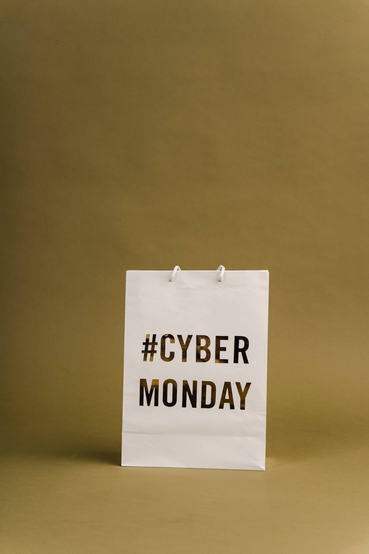 Cyber Monday, white paper shopping bag, mustard yellow background, Full HD Phone Wallpaper