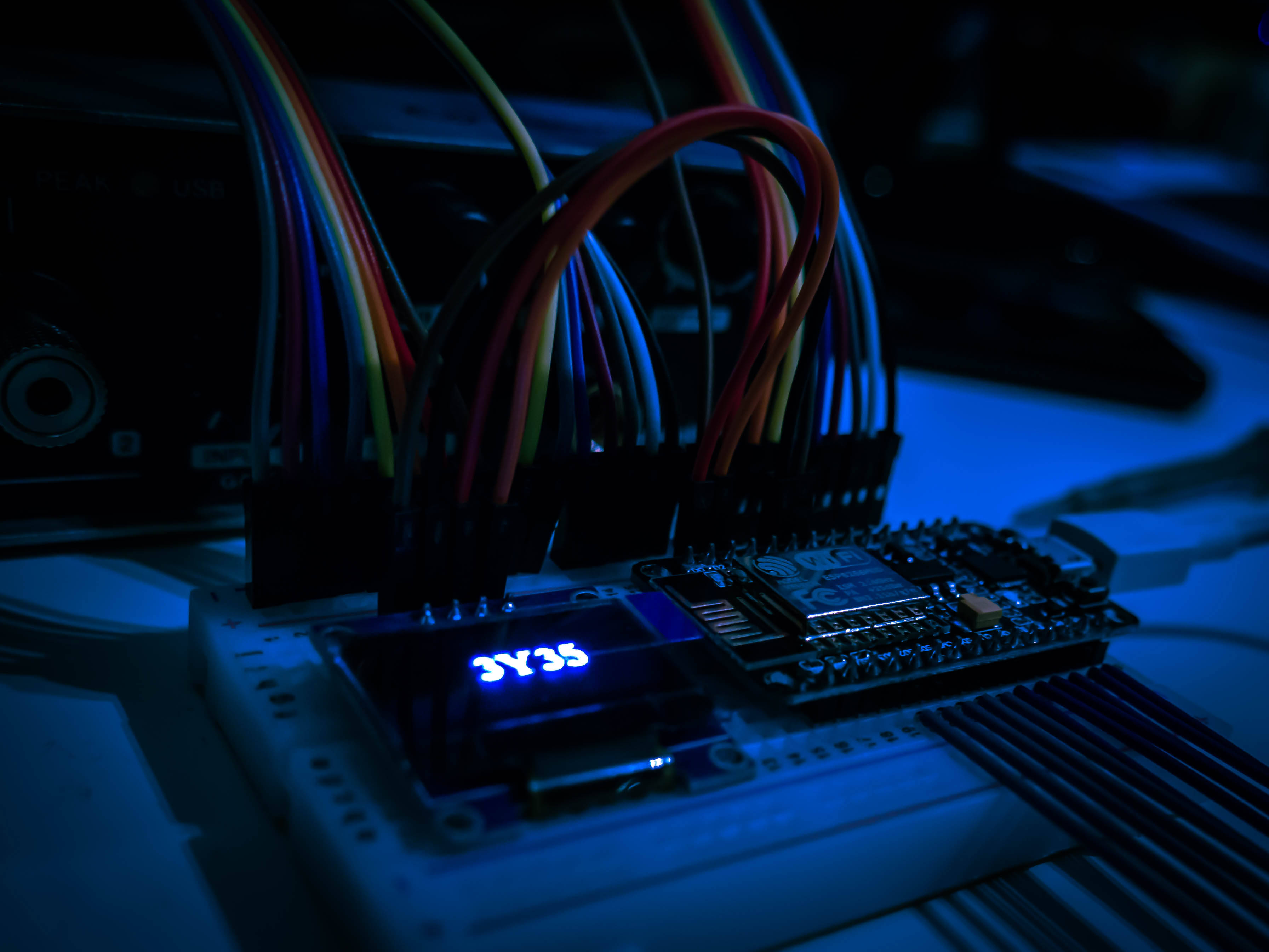 Cybersecurity, glowing blue display, colorful wires, 2K Desktop Wallpaper