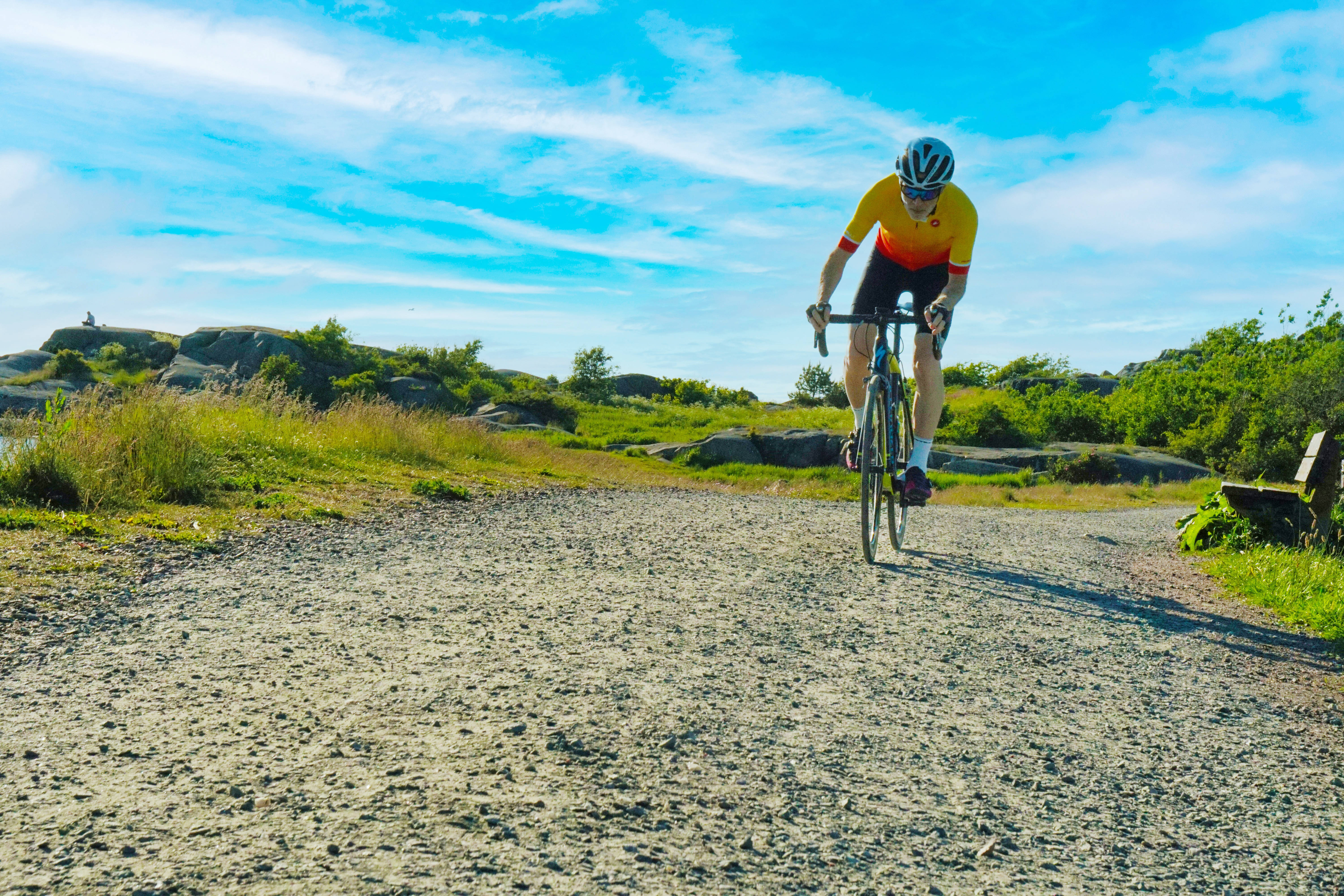 yellow jersey, gravel path, rocky green landscape, 5K Desktop Wallpaper