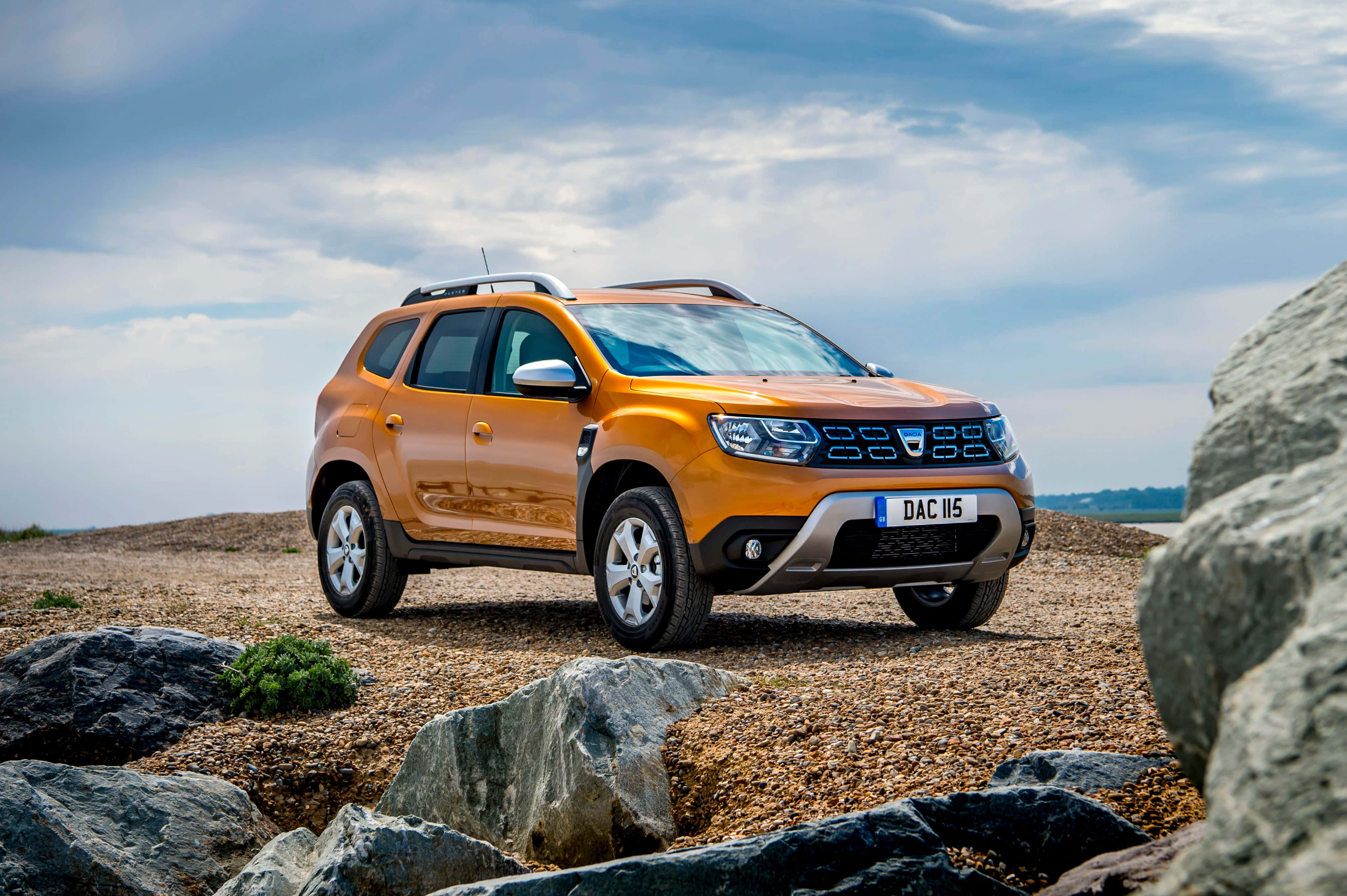 Dacia Duster, orange, rocky gravel terrain, 4K Desktop Wallpaper