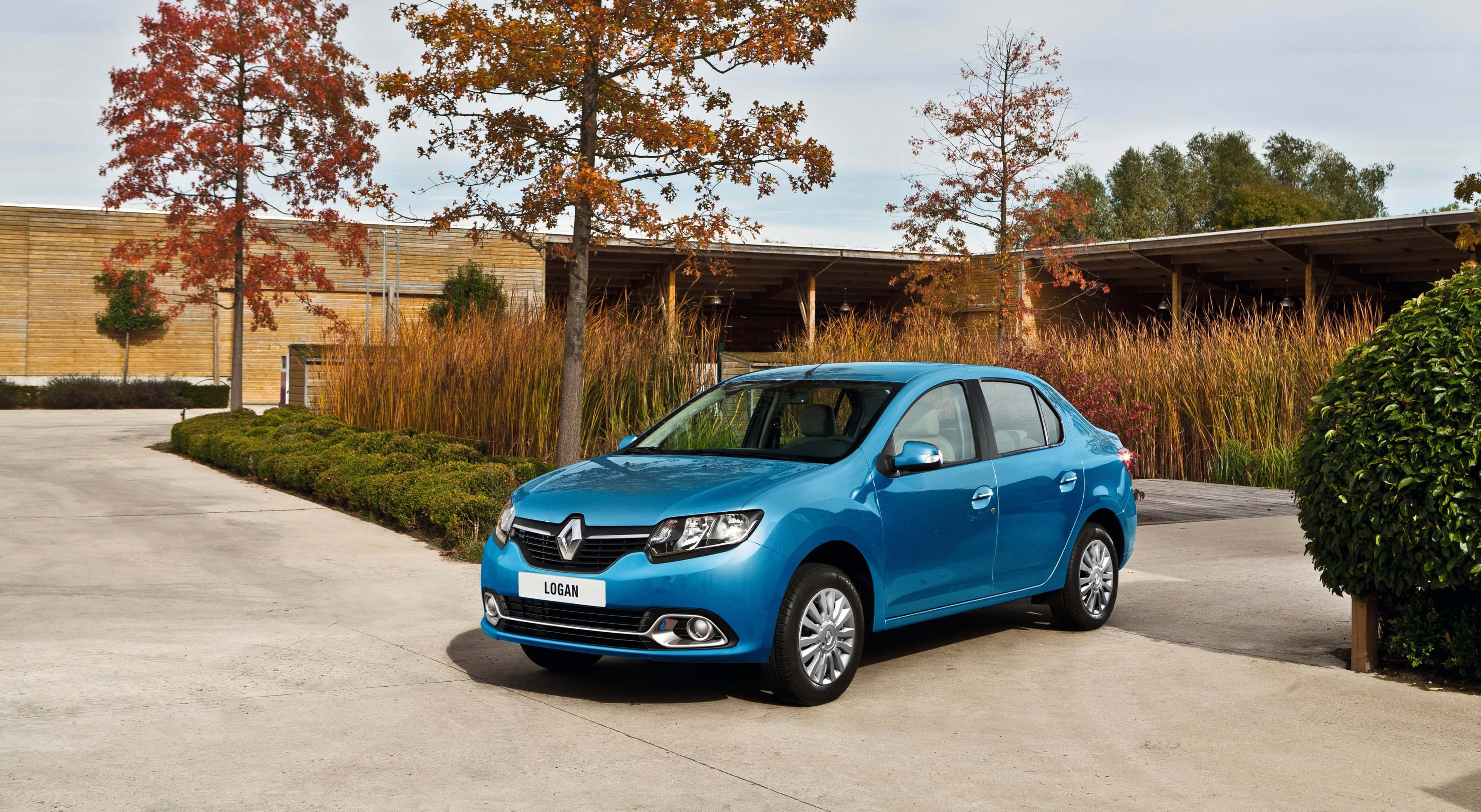 Dacia Logan, vibrant blue, paved driveway, 2K Desktop Wallpaper