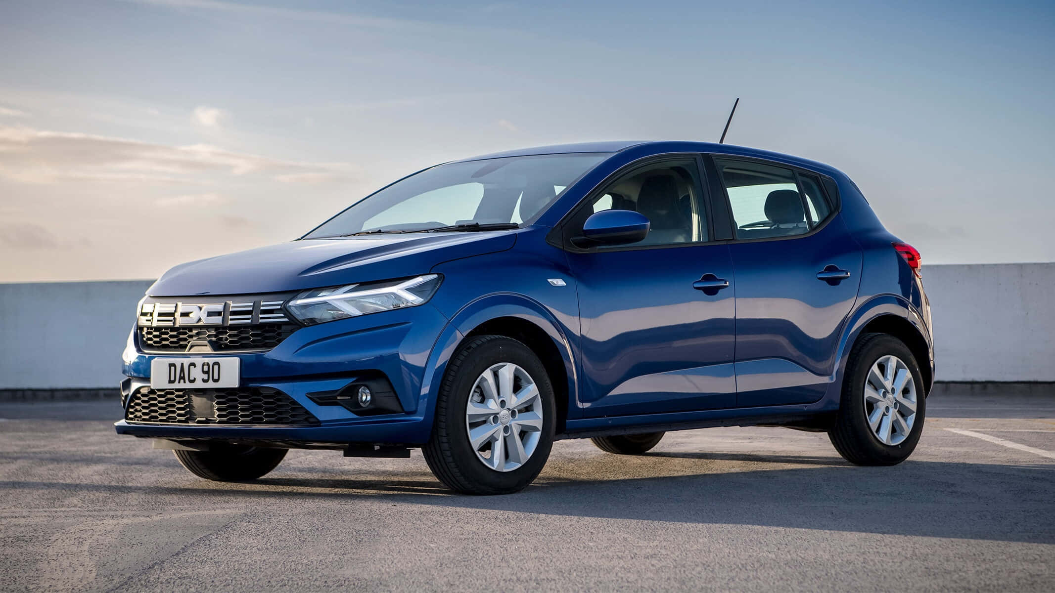 blue Dacia Sandero, paved surface, soft sky, Full HD Desktop Wallpaper