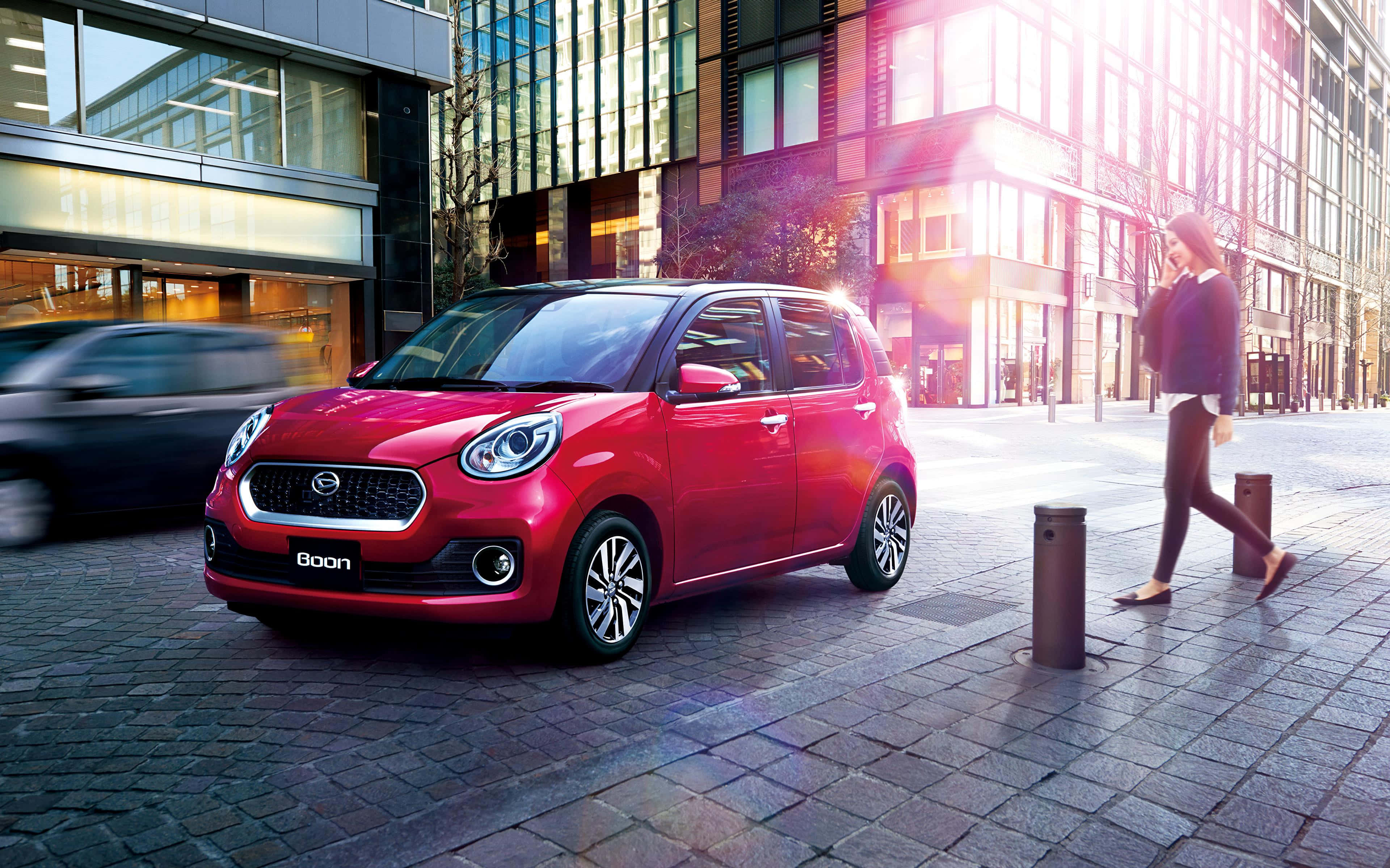 Daihatsu Sirion, vibrant red, sunlit cobblestone street, 4K Desktop Wallpaper