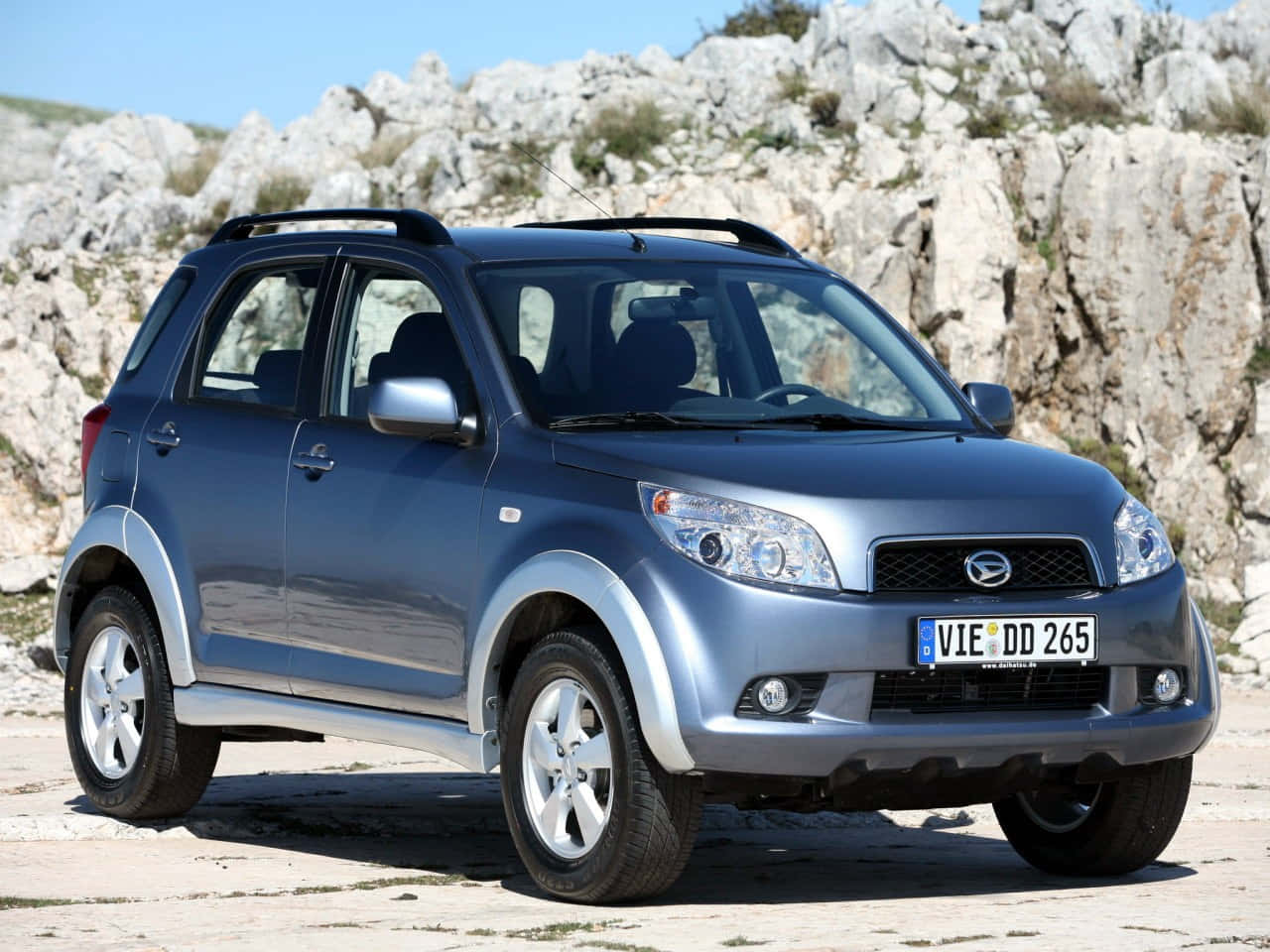 Daihatsu Terios, sleek blue SUV, sunlit stone path, HD Desktop Wallpaper